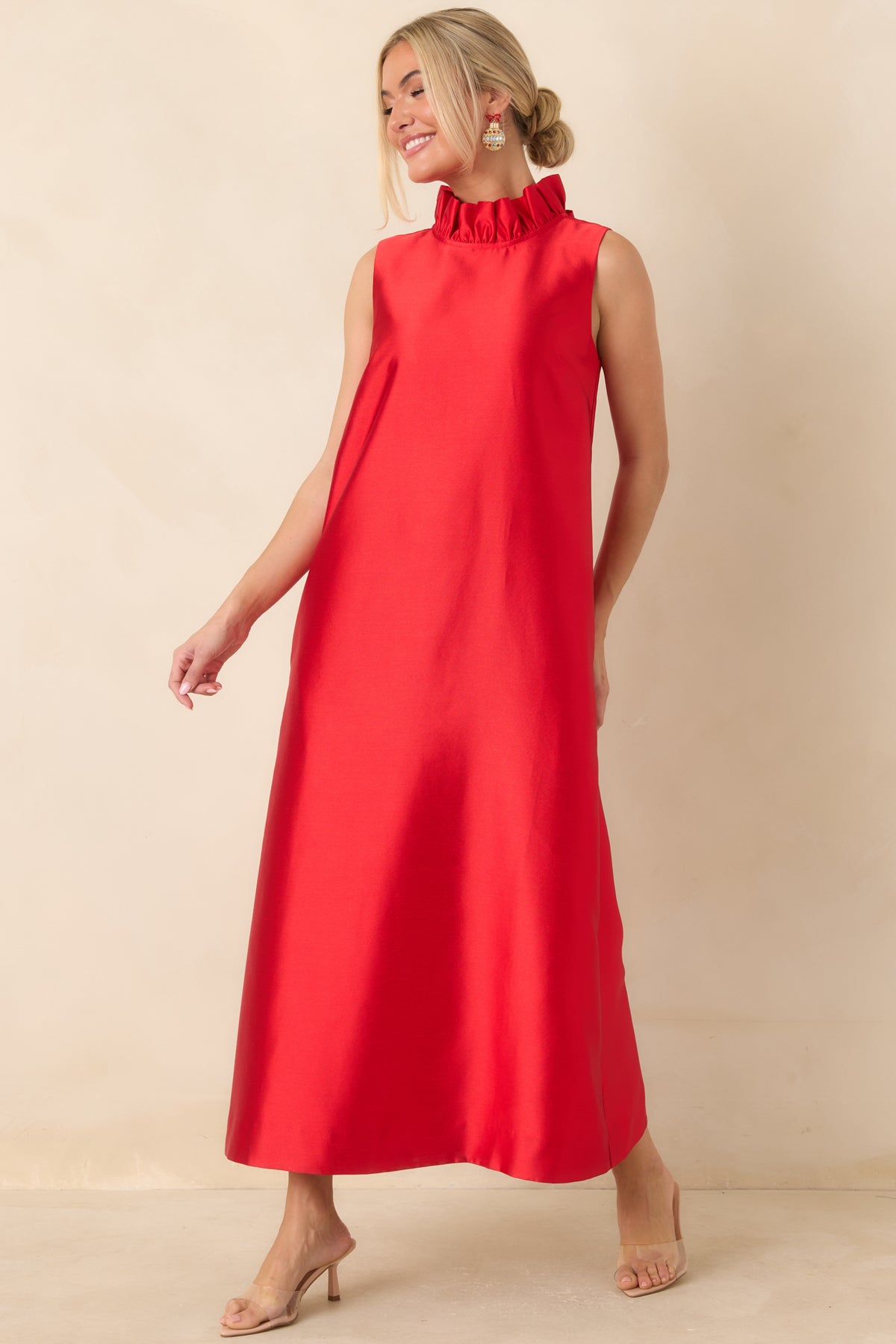 Red maxi dress with a gathered mock neckline, simple sleeveless bodice, and fluid floor-length skirt.