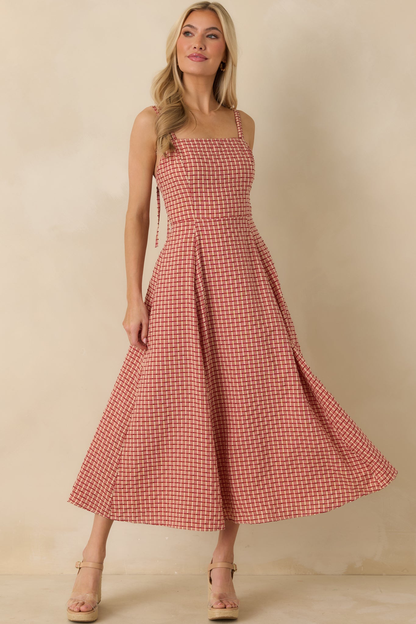 Red gingham maxi dress featuring square neckline, double spaghetti straps, and textured polka dot embroidery.