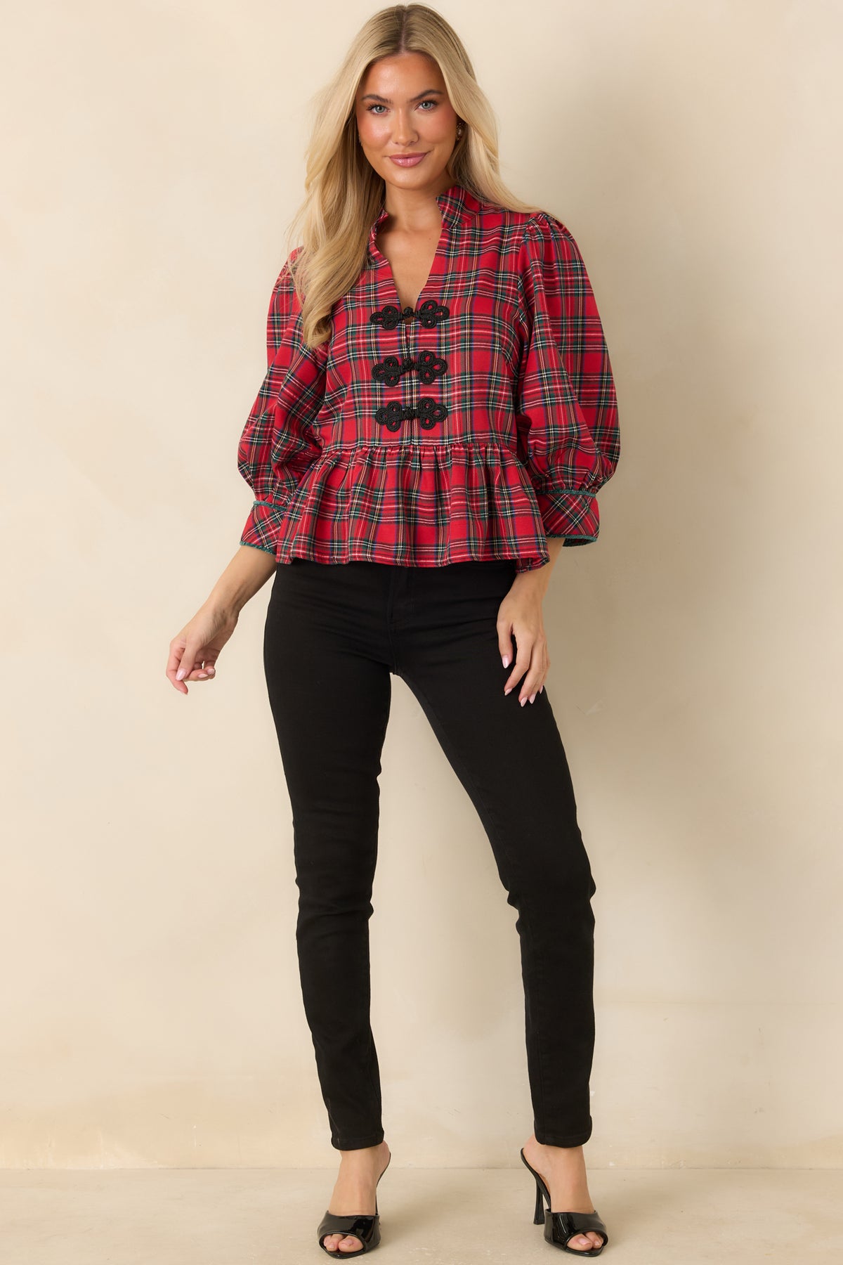 Sleek black denim featuring a high-rise waist, close-fitting stretch construction, classic front pockets, and a traditional button and zip closure.