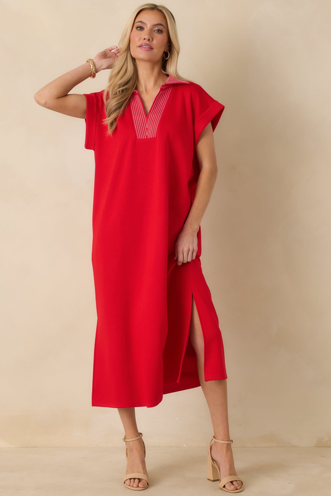 Red knit midi dress featuring short sleeves, a straight silhouette, and a flattering V-neckline.