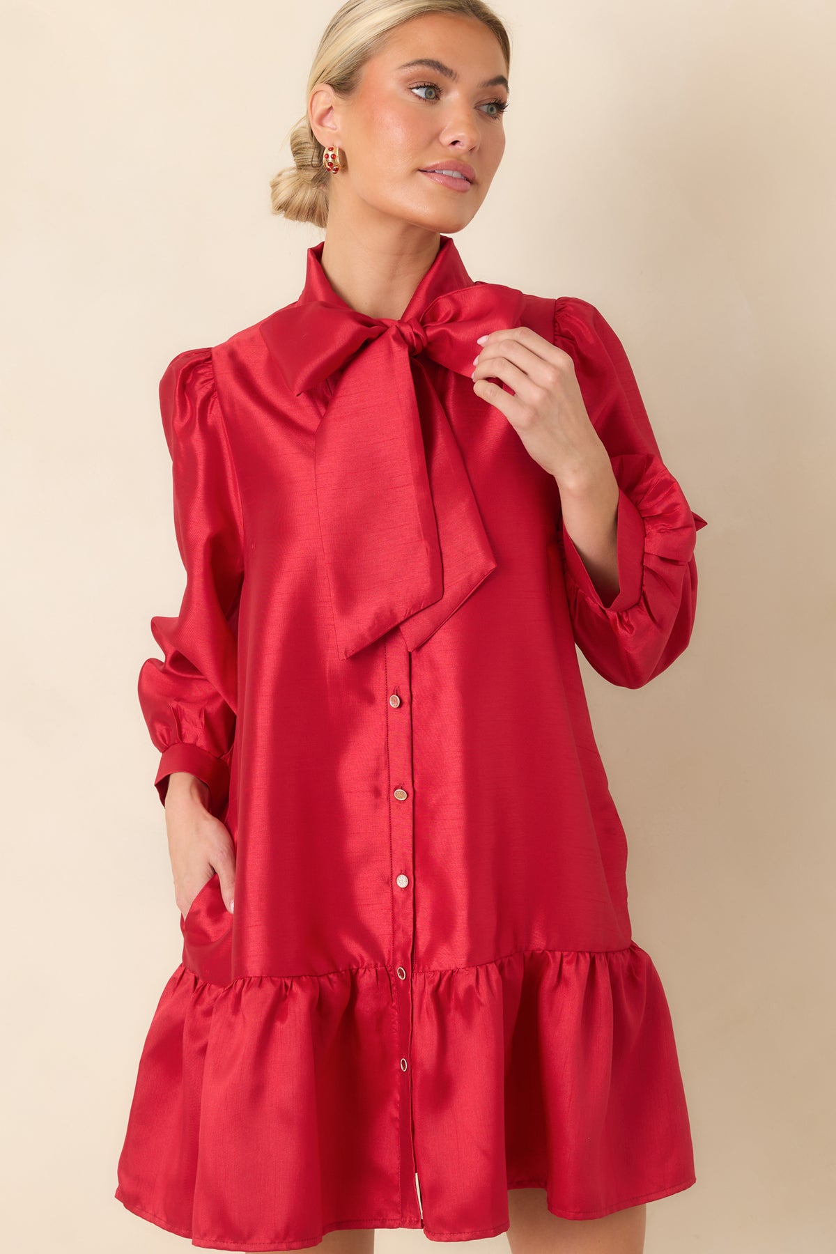 Lustrous red mini dress featuring gold-tone functional buttons arranged down the front.