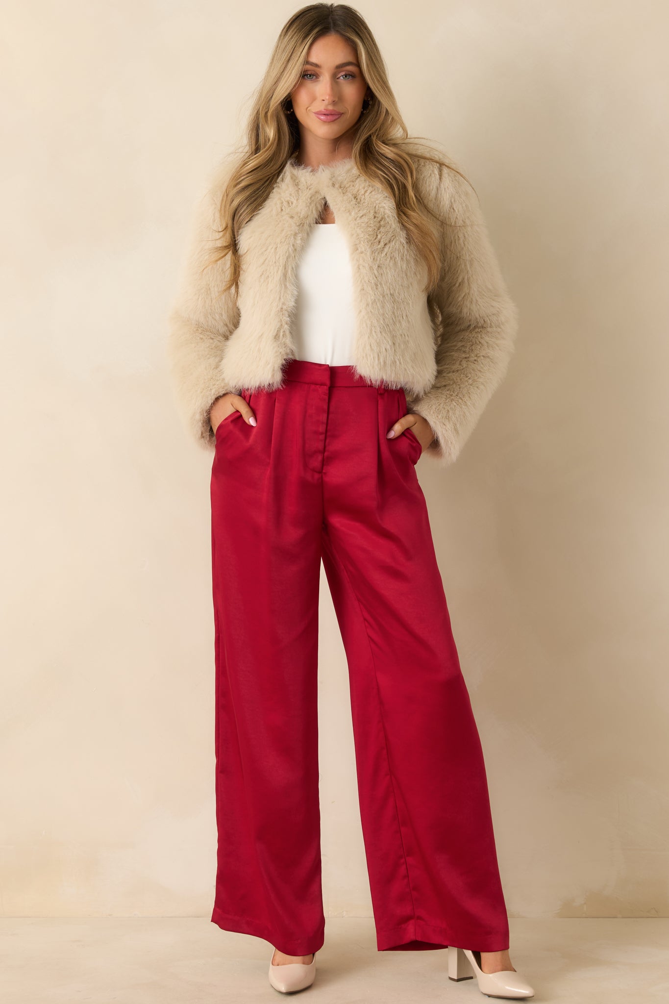 Red pants showing polished fit with belt loops, hidden zipper, and hook-and-bar closure.