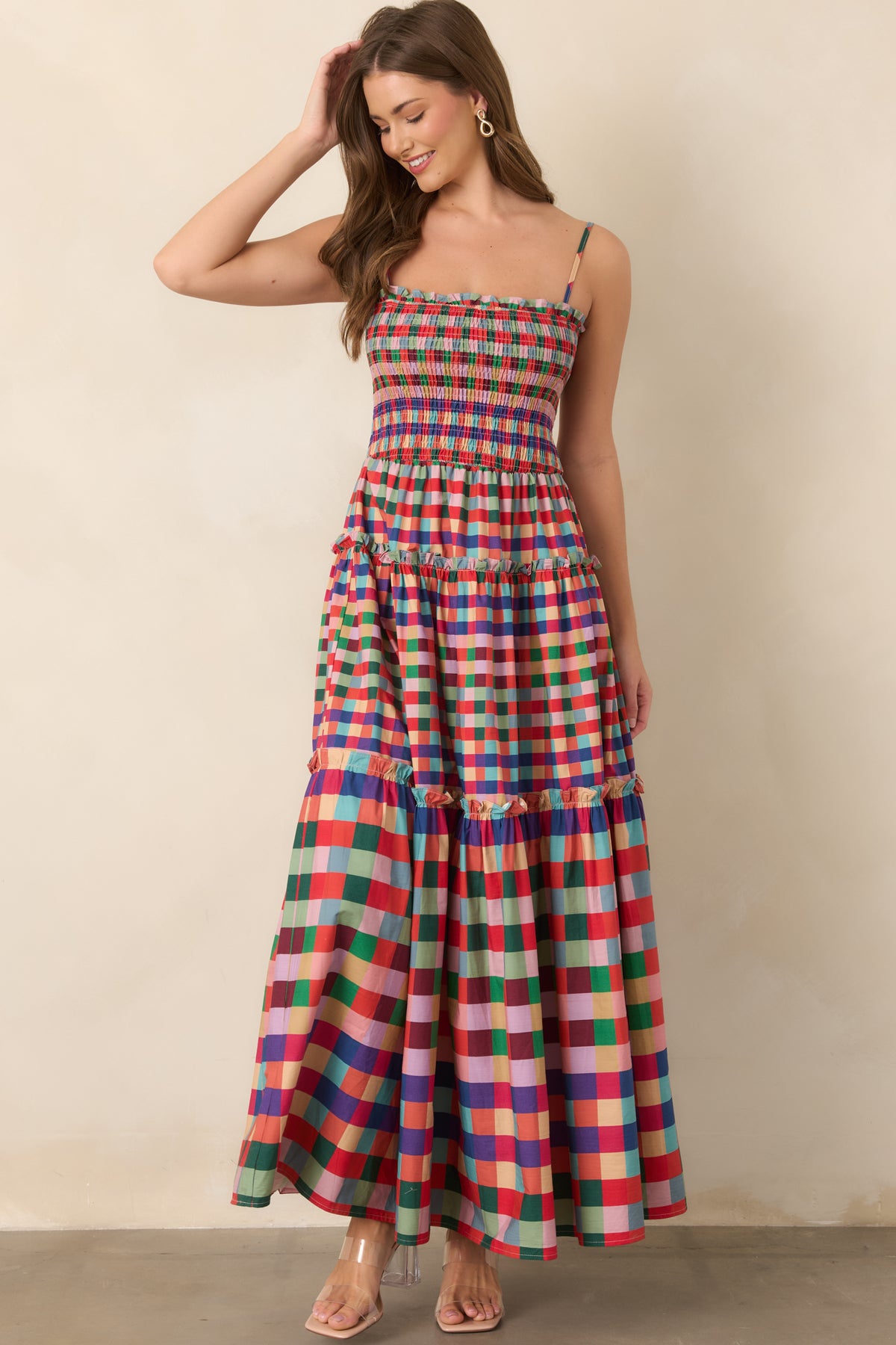 Red plaid A-line maxi dress with a comfortable smocked bodice and adjustable straps.
