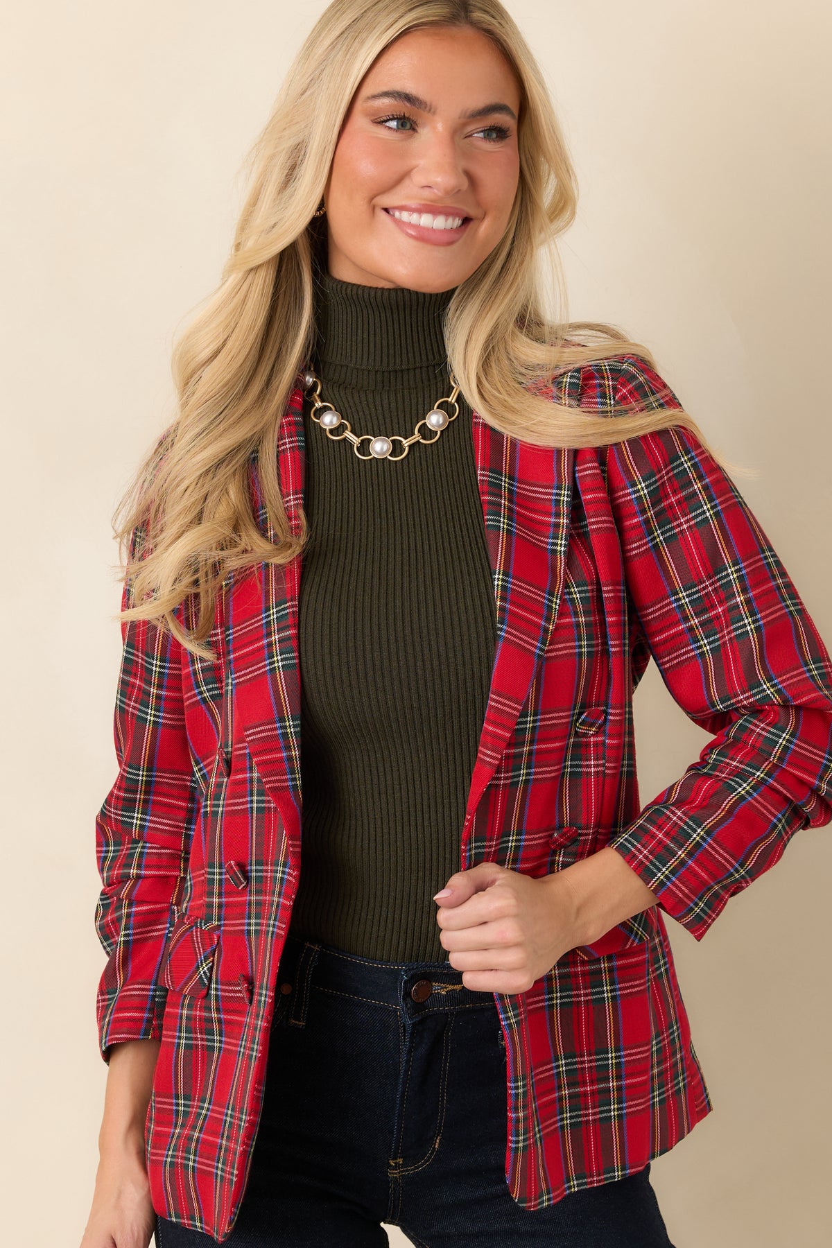 Red plaid blazer with functional front pockets and a neatly tailored button-front design.