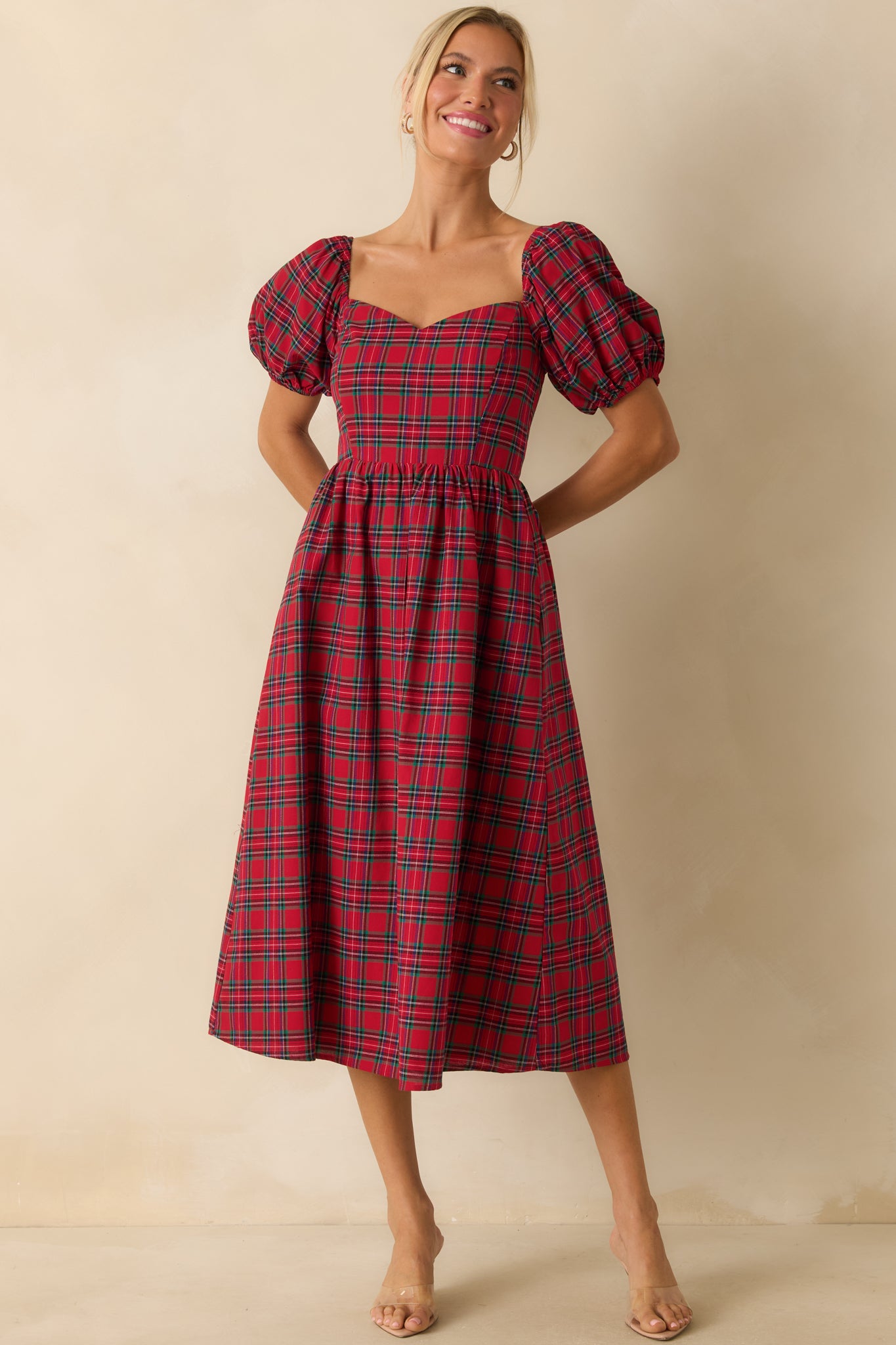 Red plaid dress with a sweetheart neckline, short puff sleeves, and a smocked back panel.