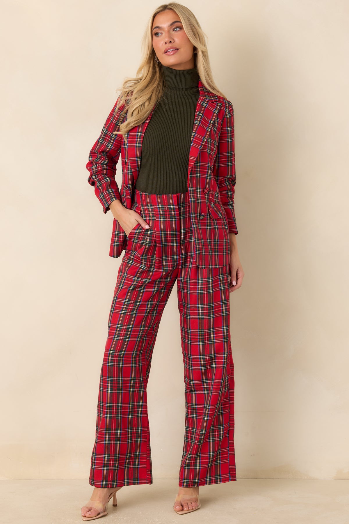 Red plaid jacket with a single-breasted button front and neatly tailored front pockets.