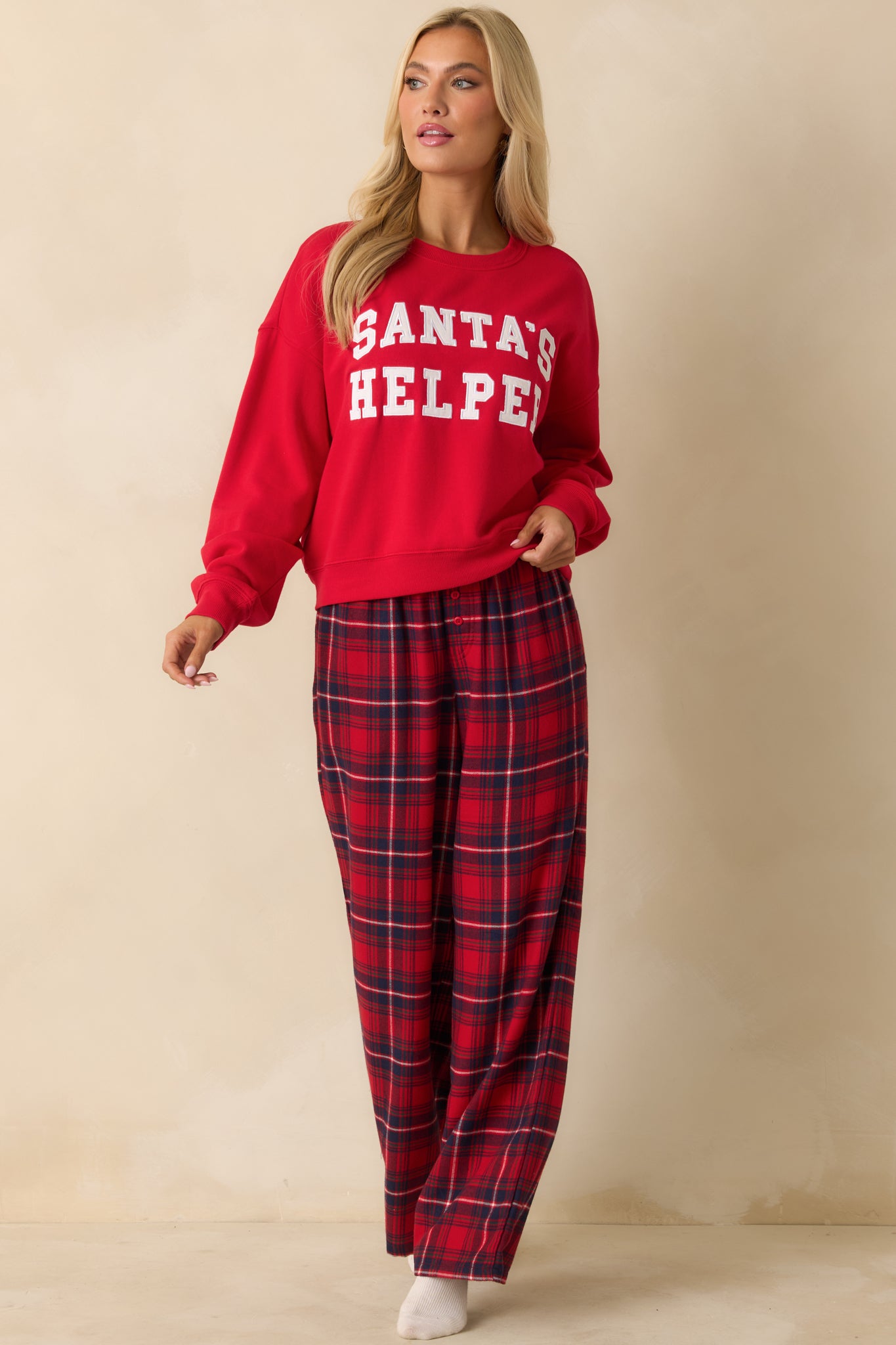Lightweight red plaid pajama pants with straight-leg silhouette, soft flannel fabric, and elastic waistband for easy wear.