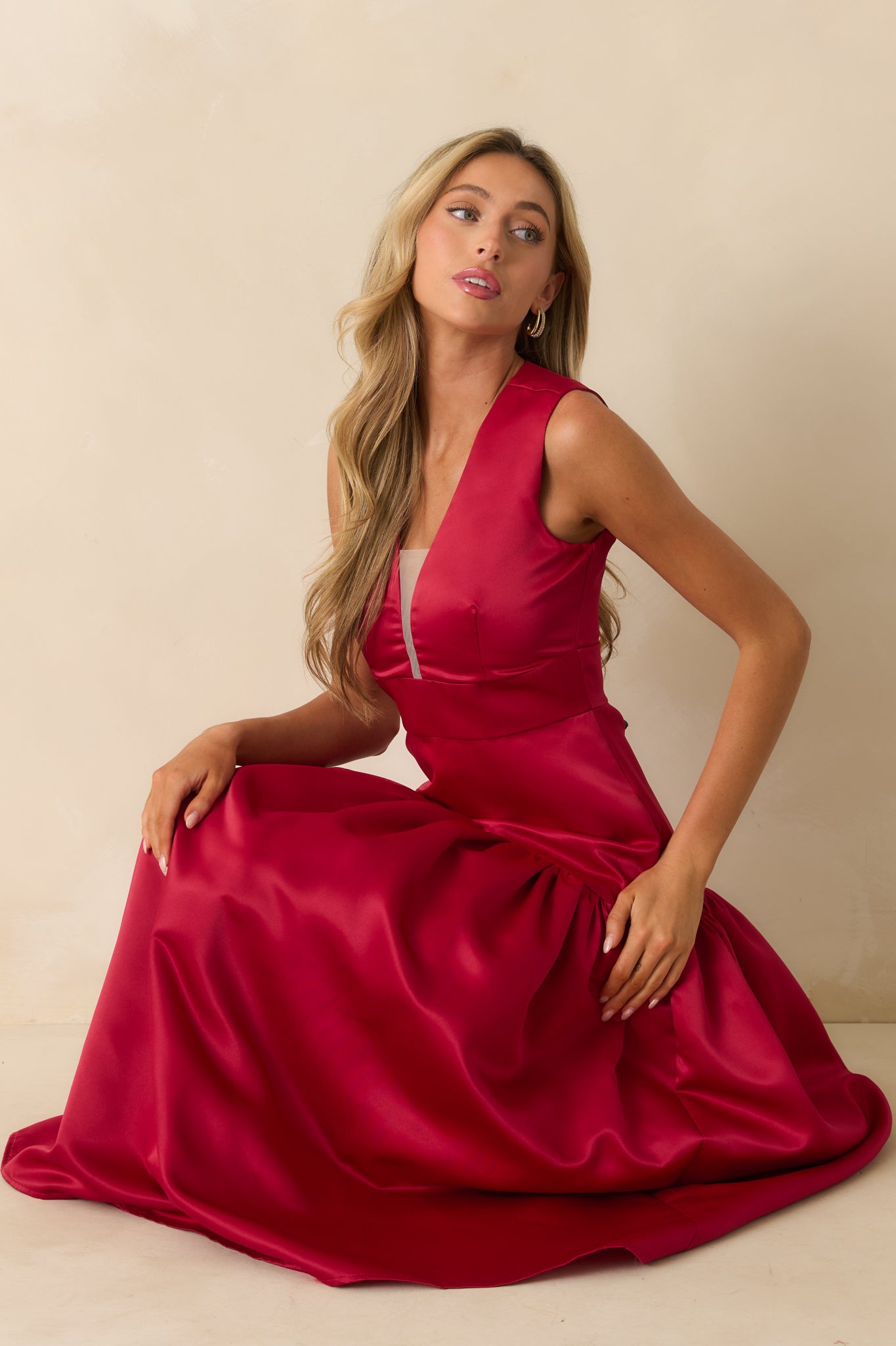 Red satin maxi dress with a deep v-neckline and sheer mesh insert.