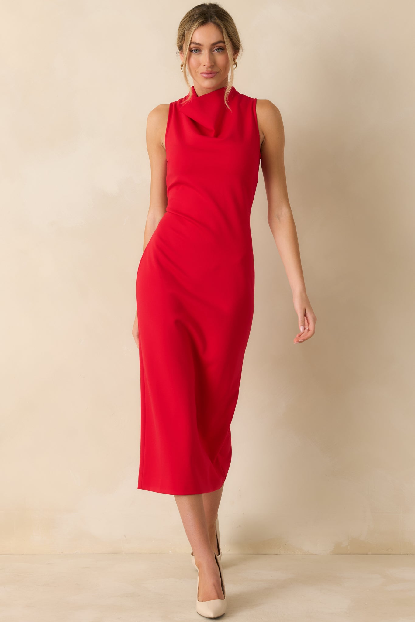 Red sleeveless midi dress with a bodycon fit, high neckline, and figure-flattering silhouette, crafted from stretchy ponte fabric.