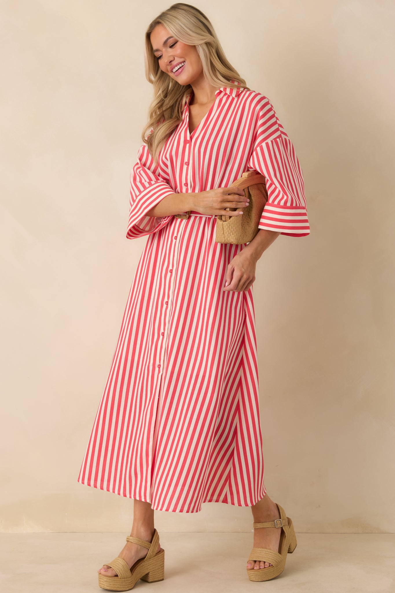 Red striped maxi shirt dress with lightweight woven fabric, collared neckline, and flowing full button-front design