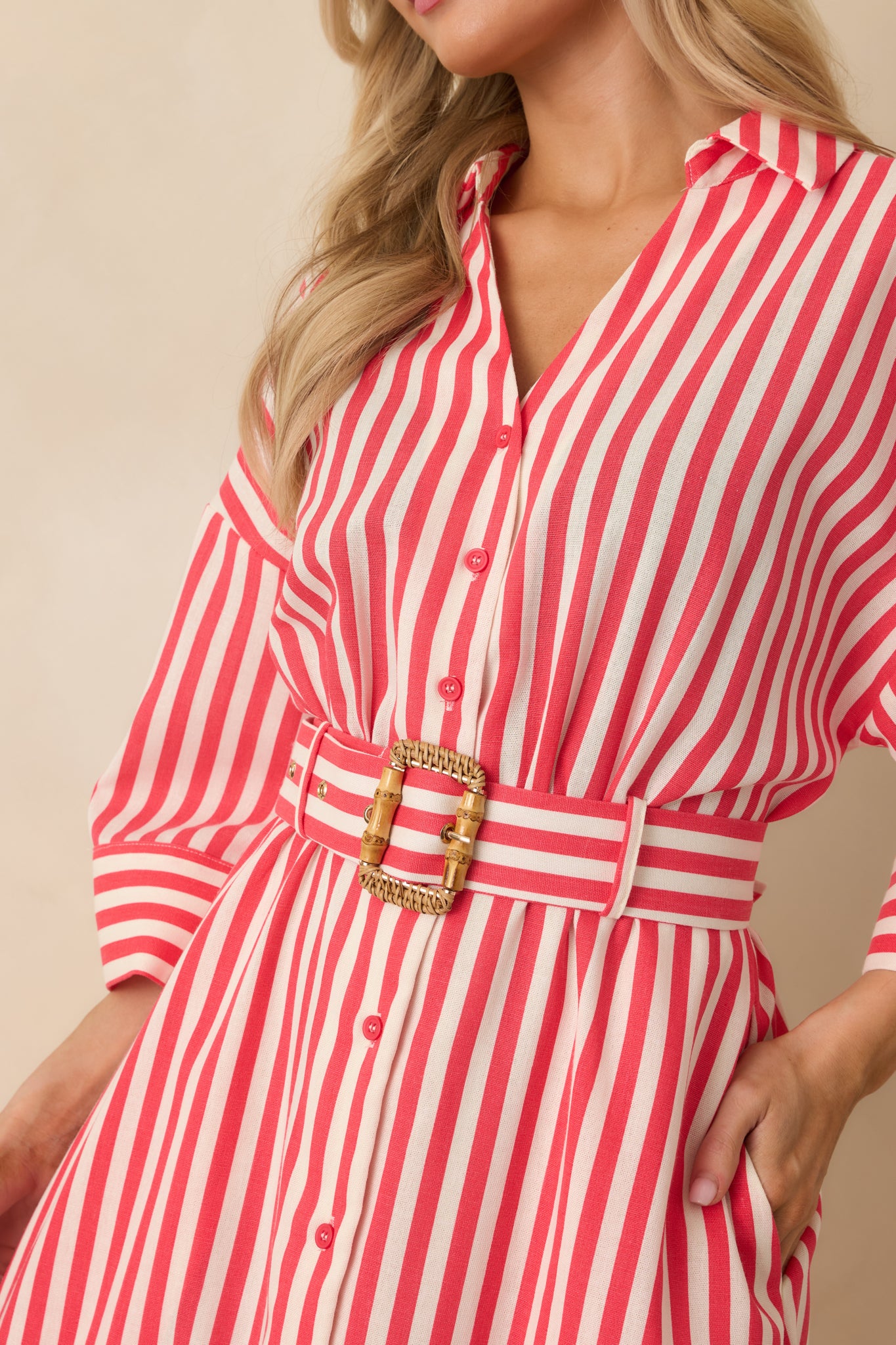 Red striped woven fabric detail showing crisp button-front closure and lightweight texture
