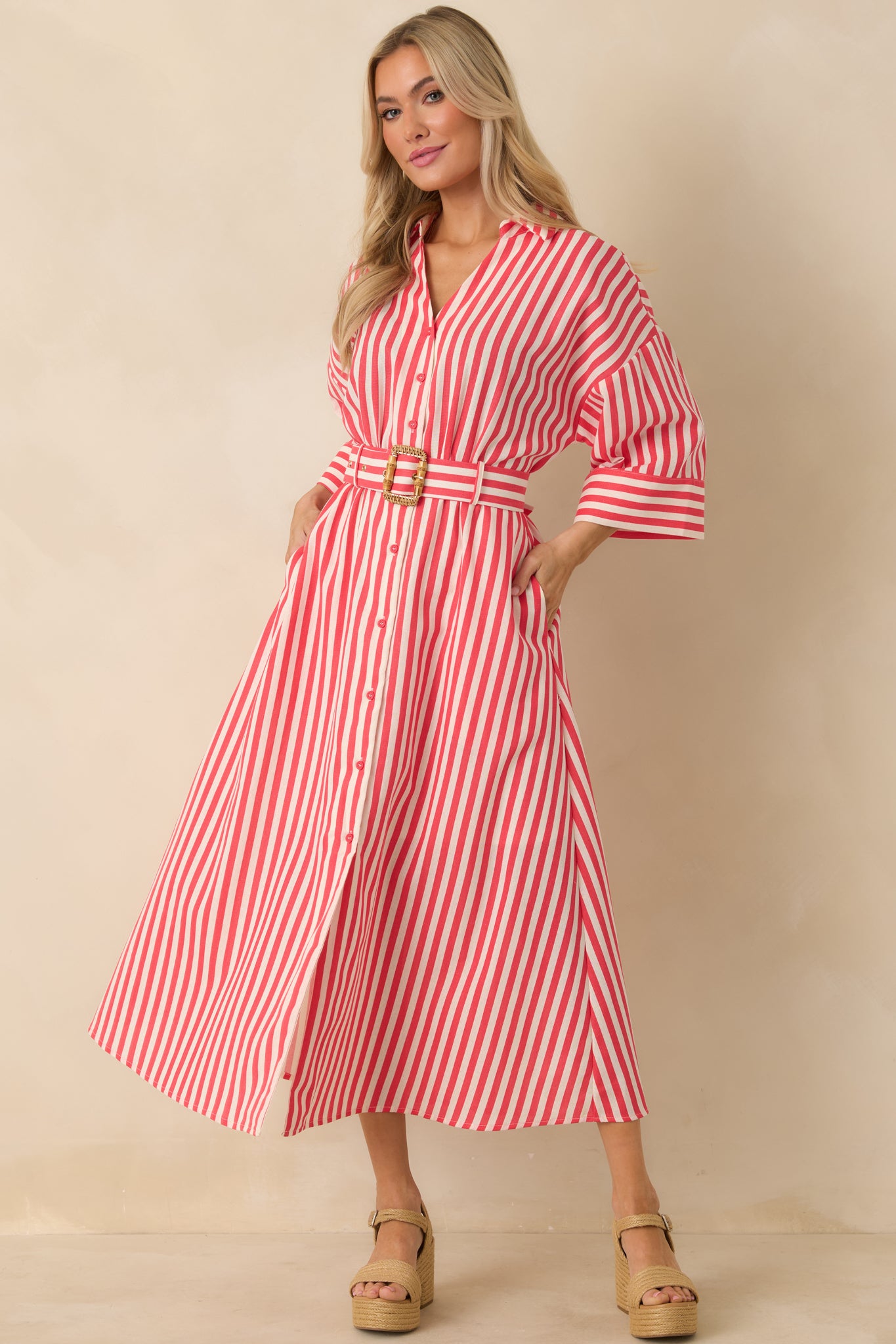 Red striped woven maxi dress highlighting clean vertical stripes, button-front styling, and relaxed shape