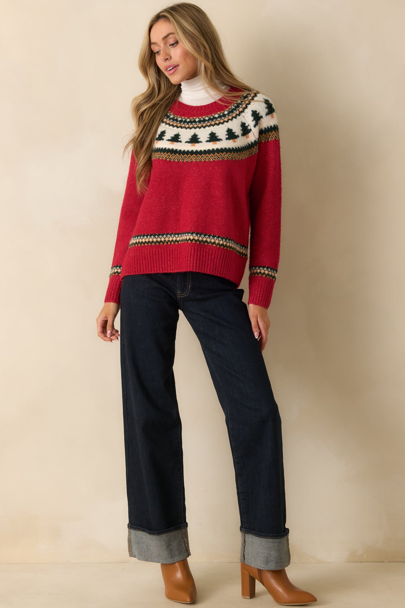 Straight-on front view emphasizing the vibrant pattern and midweight yarn construction of the red sweater.