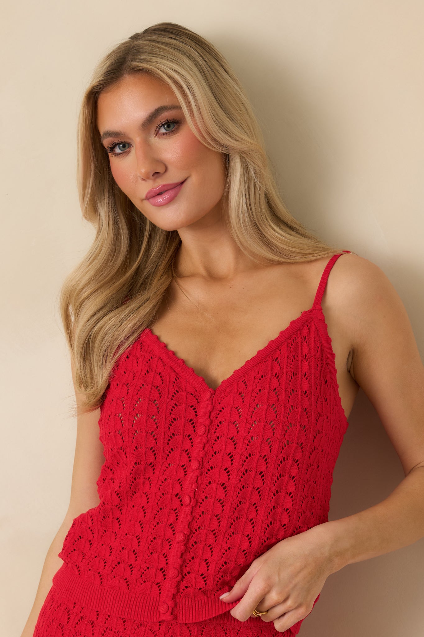 Close look at the ribbed hem detailing on the red sweater tank.