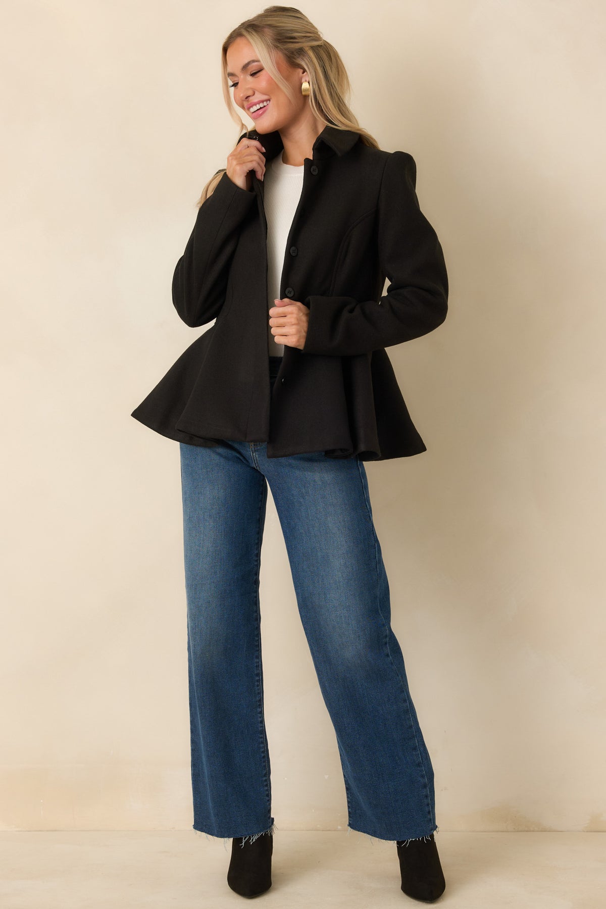 Refined felt jacket featuring a fitted waist, puffed shoulders, and flared peplum hem.