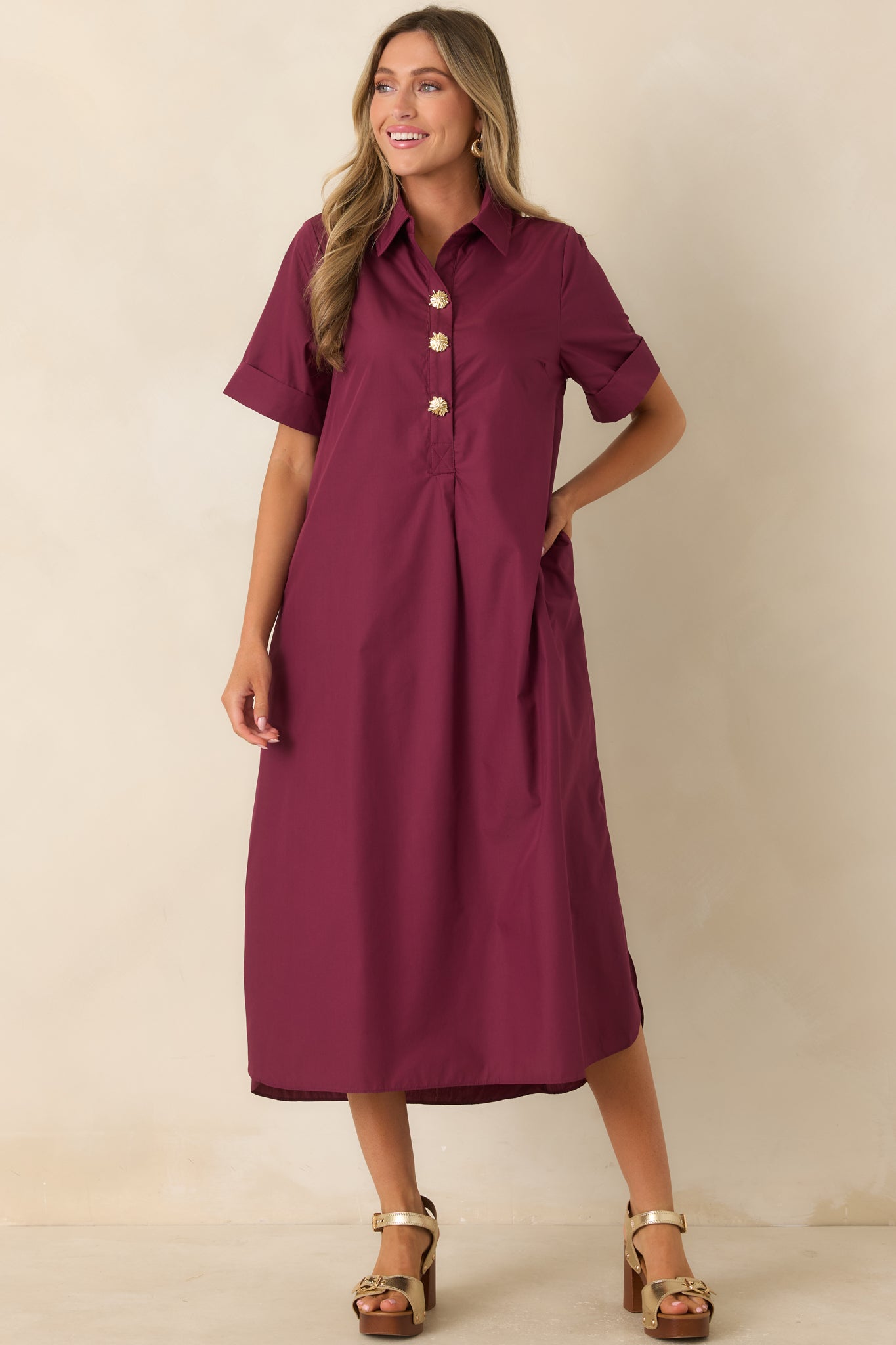 Relaxed A-line maxi dress featuring a classic collar, woven fabric, and elegant gold floral button details.