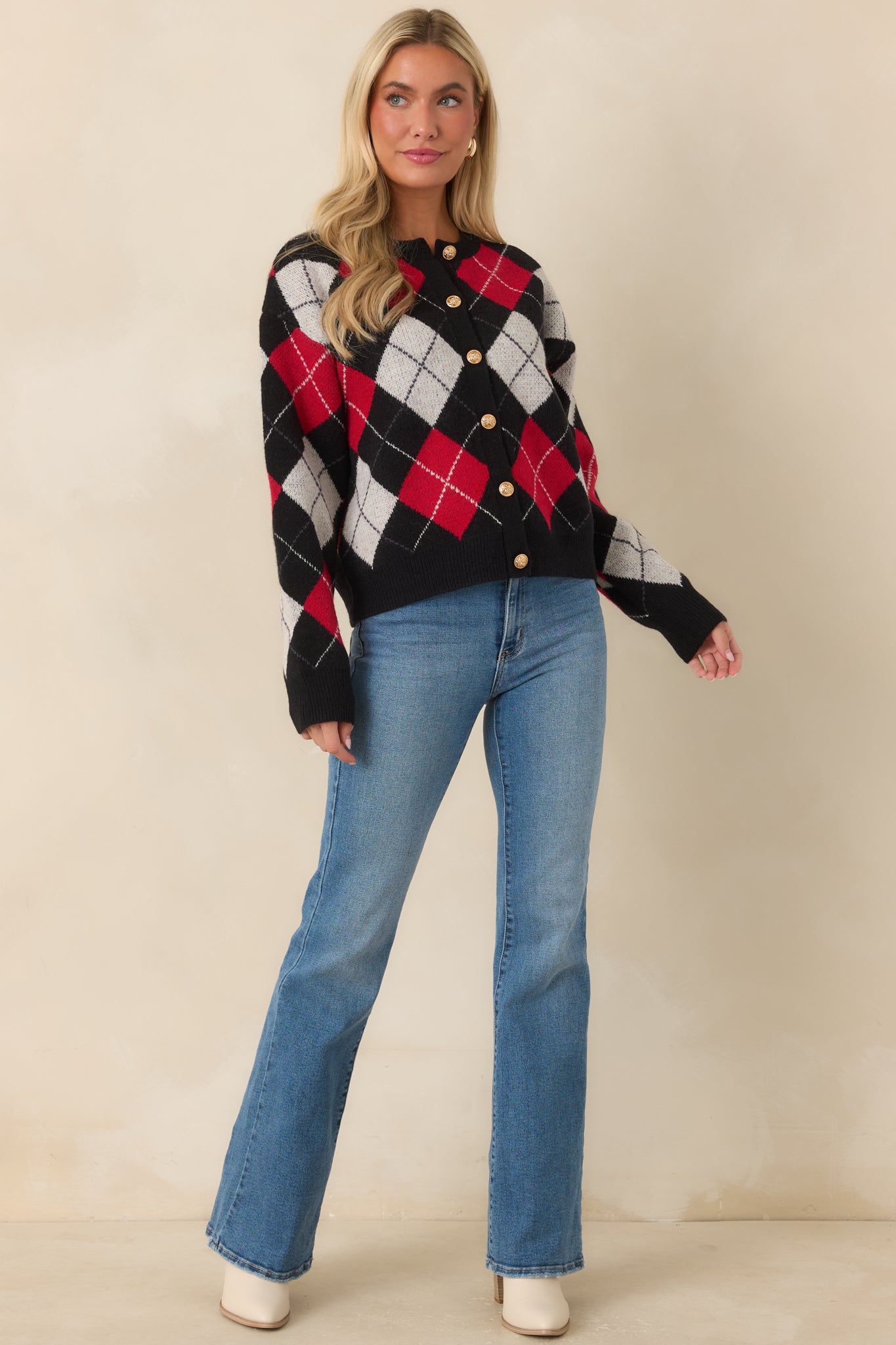 Relaxed argyle cardigan featuring a button-front design, ribbed edges, and a classic multicolor diamond pattern.