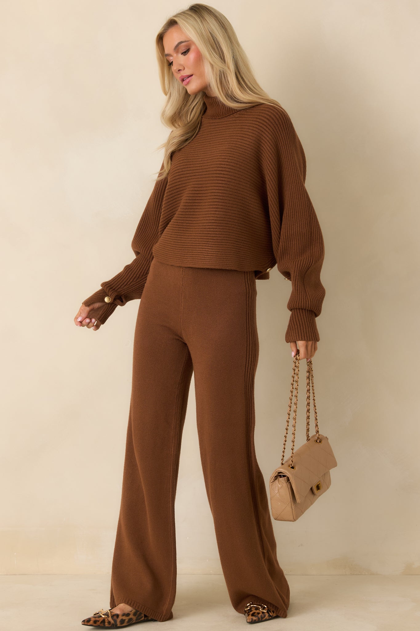 Relaxed fit brown knit pants with comfortable waistband and clean seam construction.