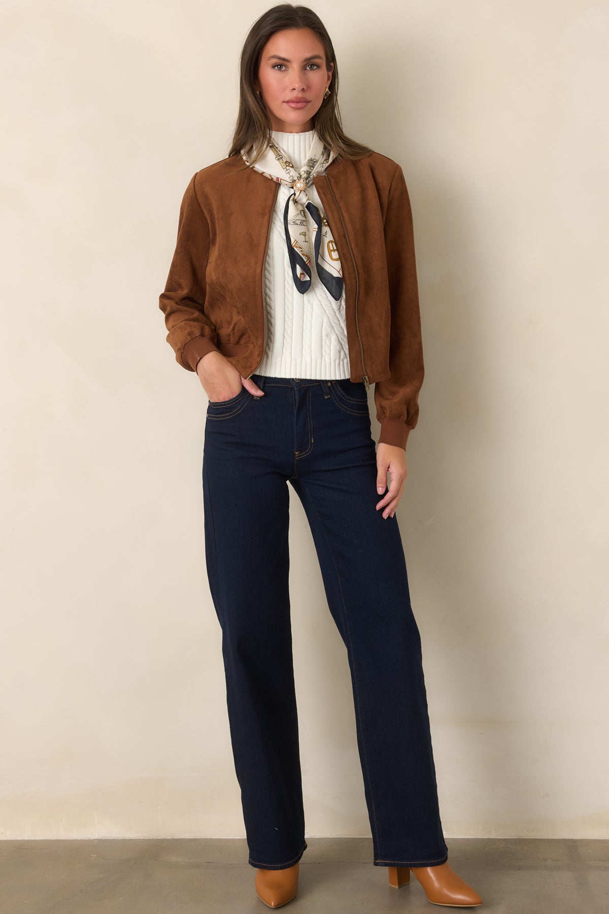 Deep indigo jeans featuring a high-rise waist and full-length wide-leg silhouette.
