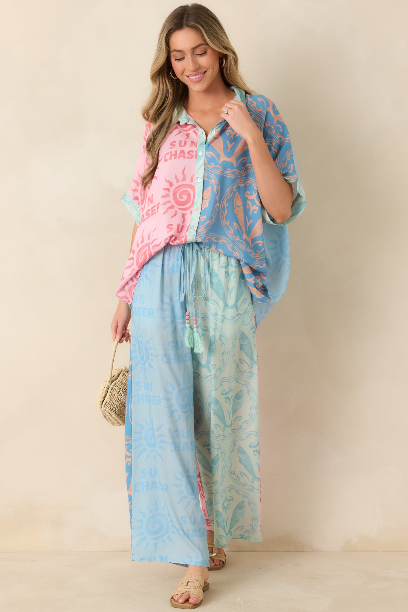Relaxed button-up top featuring bold colorblocking, soft sun details, and lightweight breathable construction.