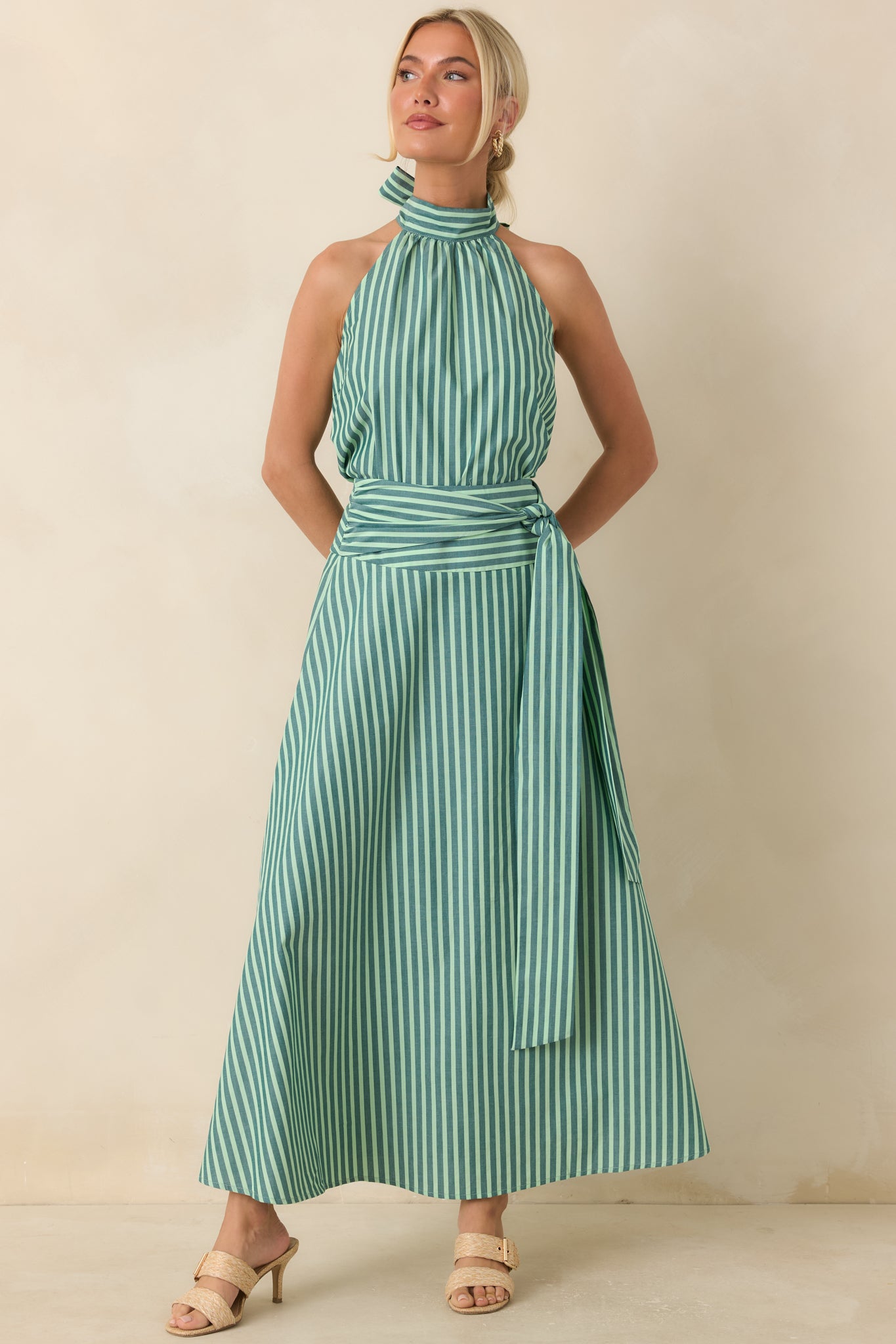 Relaxed cotton halter top showcasing a timeless striped pattern, gathered neckline, and airy sleeveless design for effortless styling.