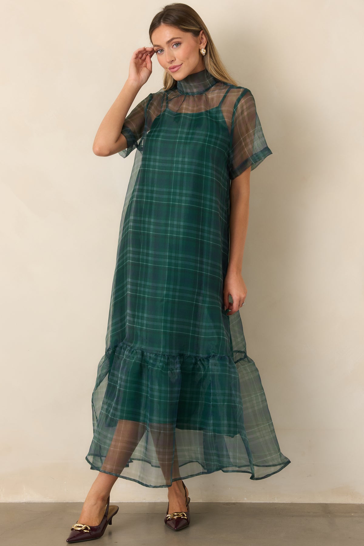 Relaxed emerald overlay dress with a coordinating slip and flowing flounce hem.