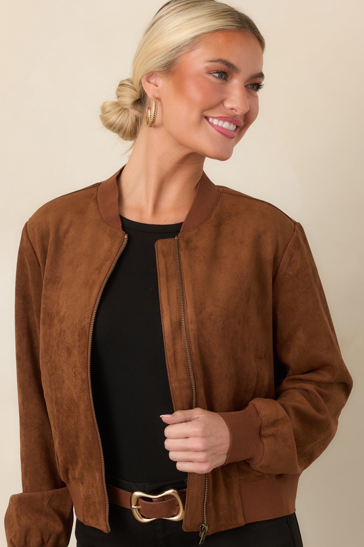 Relaxed jacket showcasing the soft faux suede texture and sporty ribbed hem.