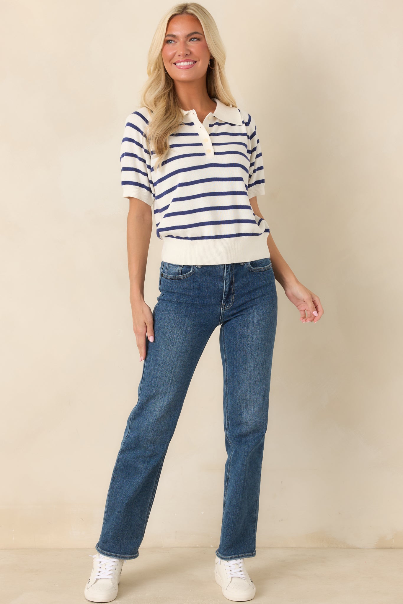 Relaxed fit knit top featuring a classic collar, horizontal stripes, and a clean finished hem.