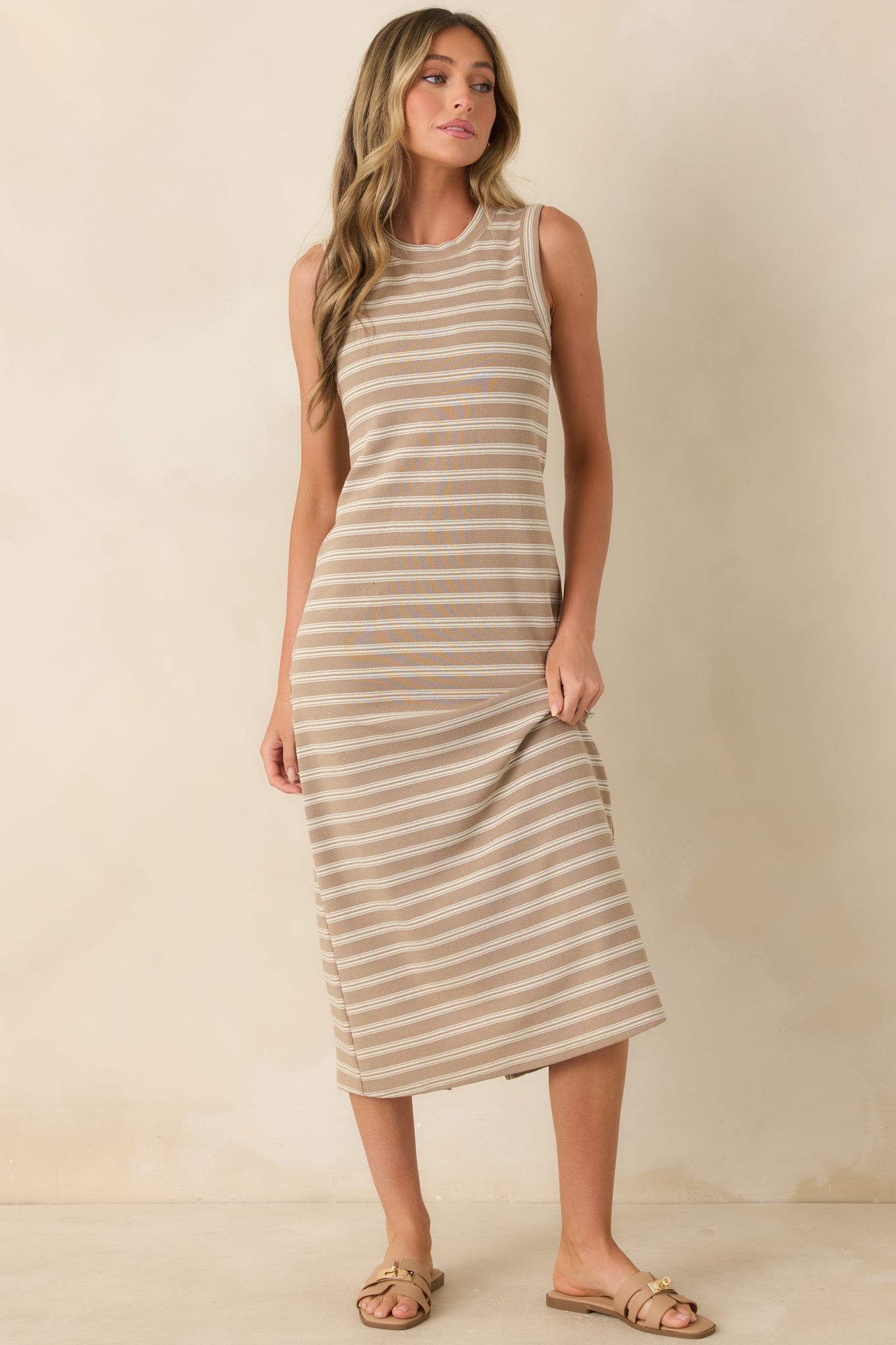 Relaxed fit midi dress with a timeless striped pattern and comfortable everyday styling.