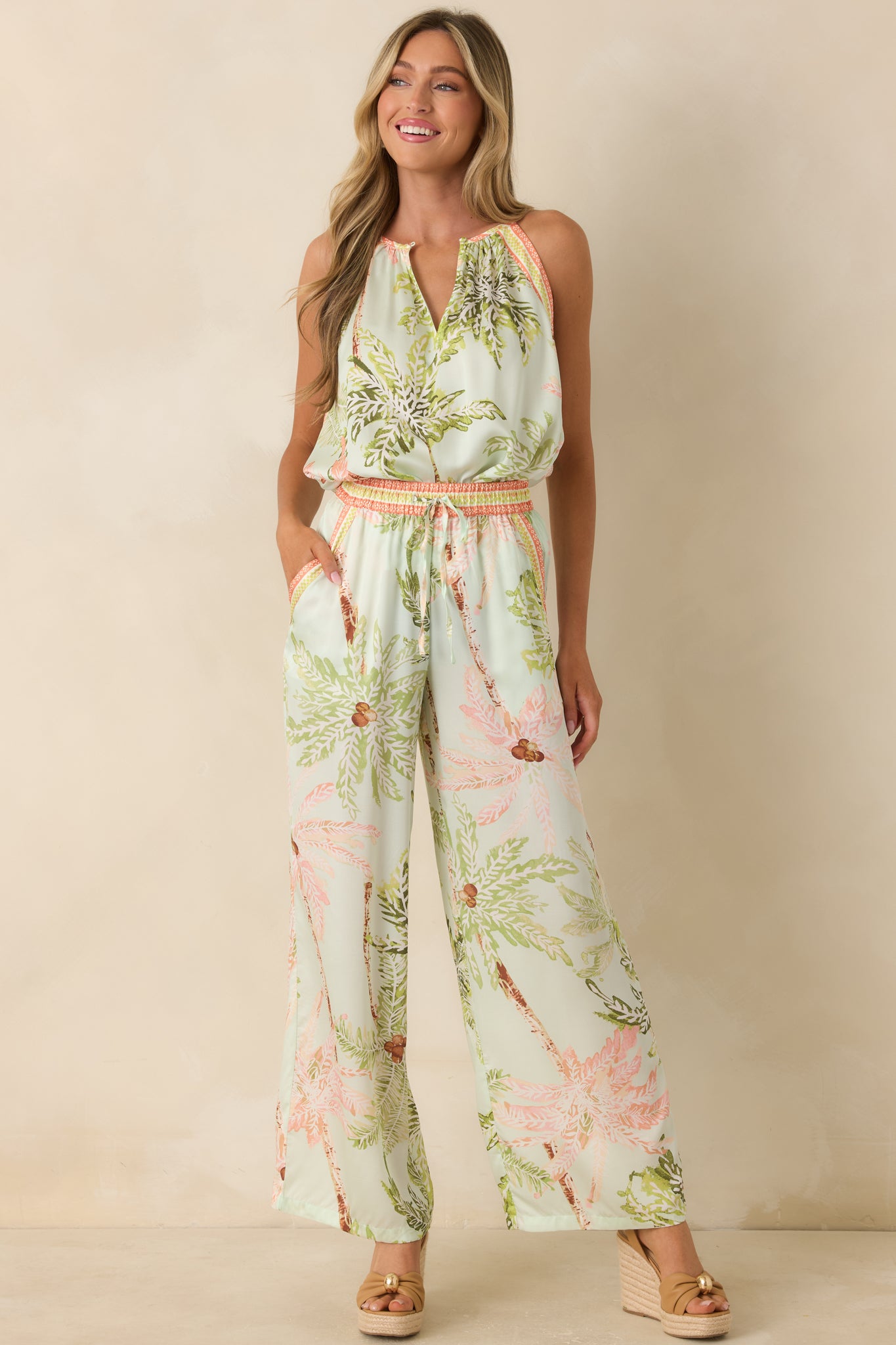 Relaxed-fit seafoam top featuring contrast trim accents and an allover tropical-inspired print.