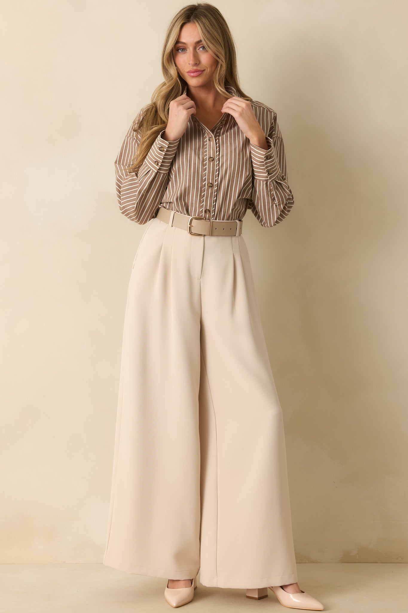 Relaxed-fit shirt with long sleeves, functional buttons, and softly curved bottom hem.