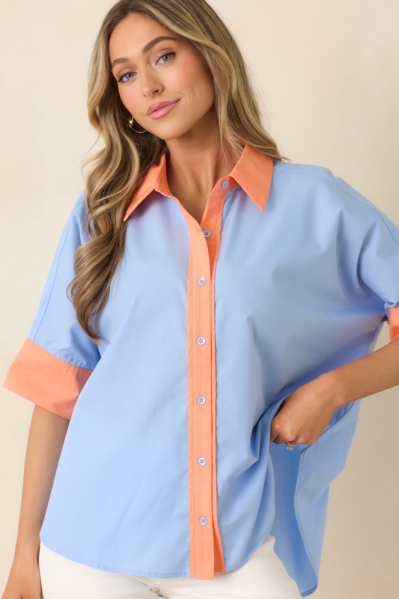 Relaxed fit top, showcasing the contrast cuffs and clean, polished design.