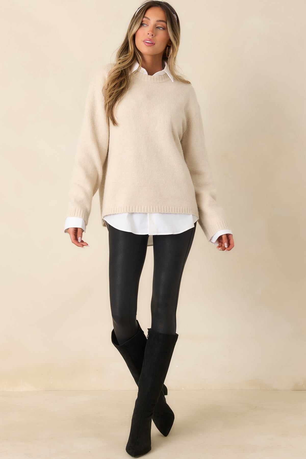 Relaxed fuzzy knit top featuring a classic crew neckline and dropped shoulder seams.