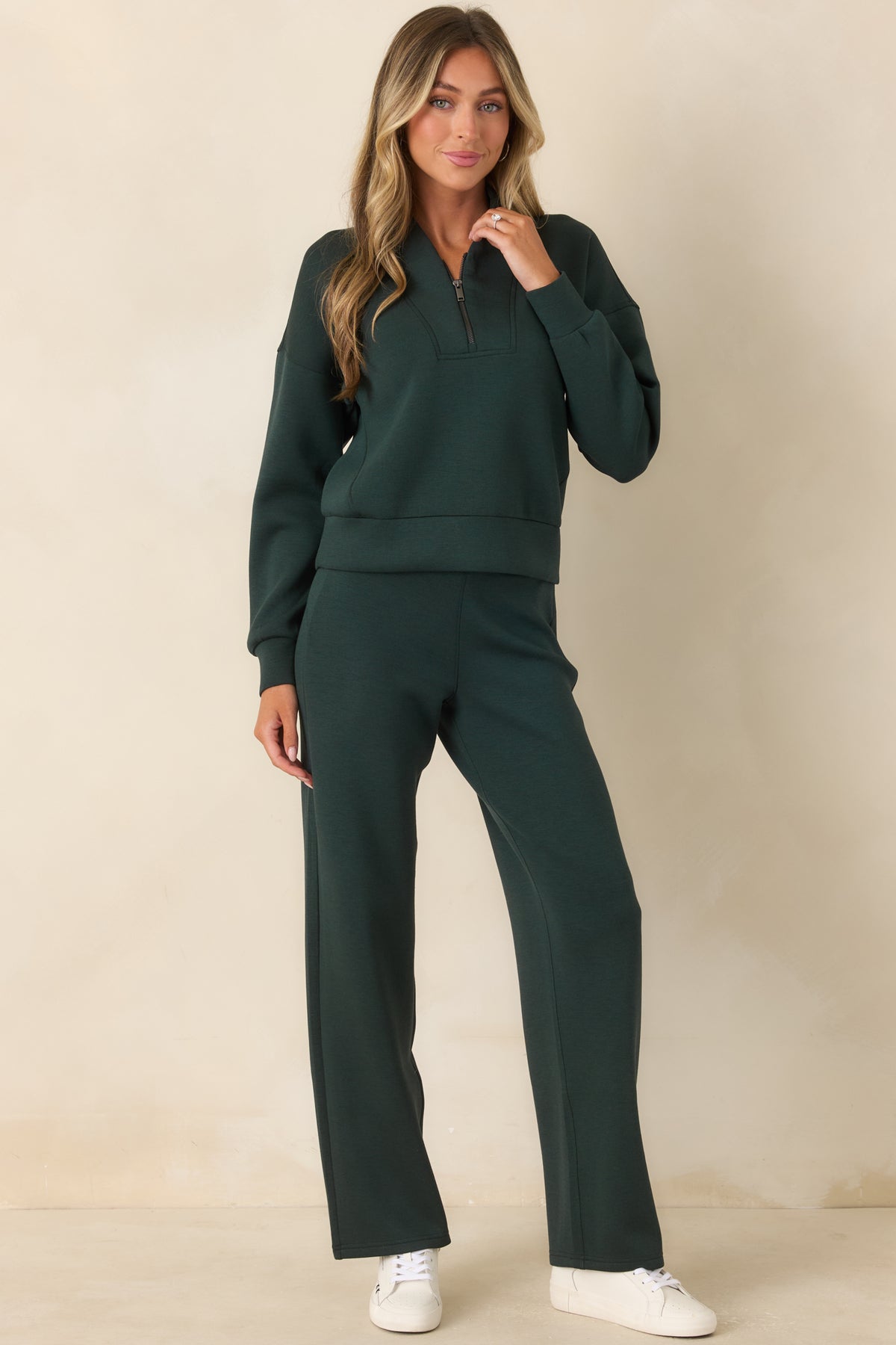 Relaxed half-zip pullover featuring a sculptural shawl collar, wide banded hem, and softly draped silhouette.