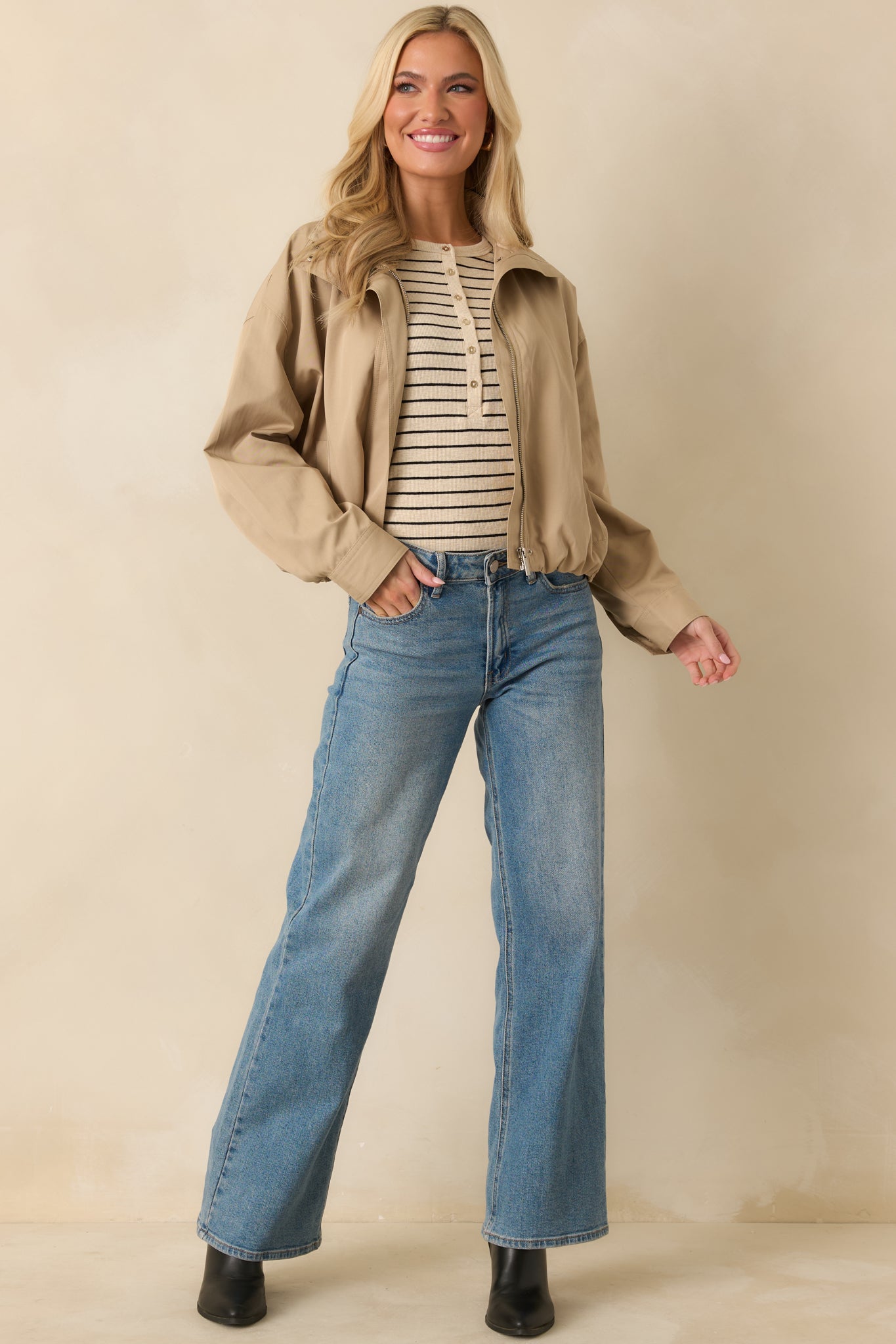 Relaxed-fit khaki bomber featuring dropped shoulders, long sleeves, and slightly cropped silhouette.