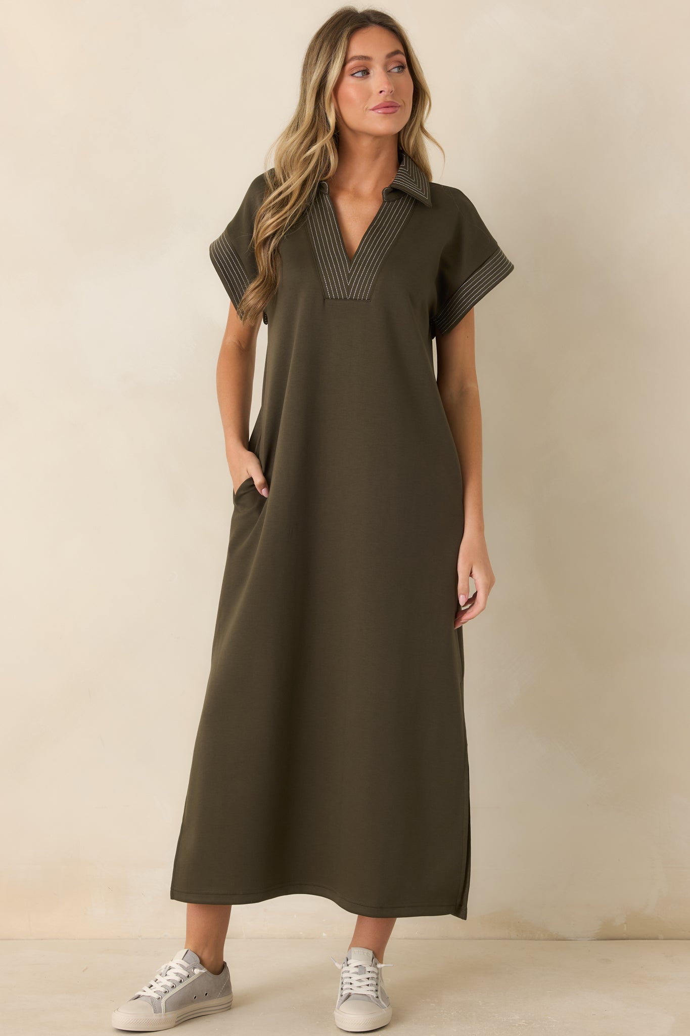 Relaxed knit maxi dress showcasing a structured collared neckline, contrast trim detailing, and an easy everyday shape.