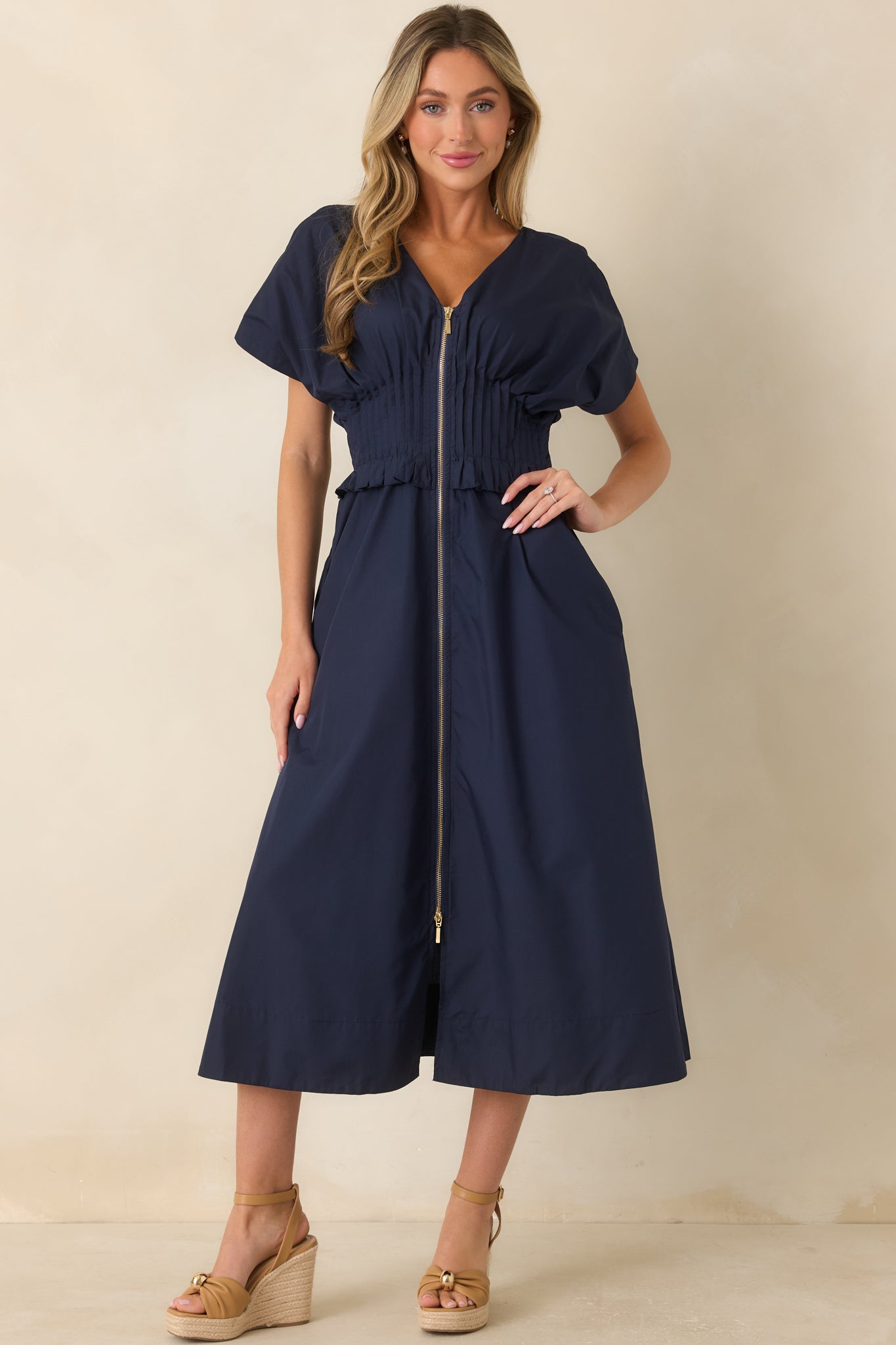 Relaxed navy maxi dress featuring a soft structured shape and polished woven design.