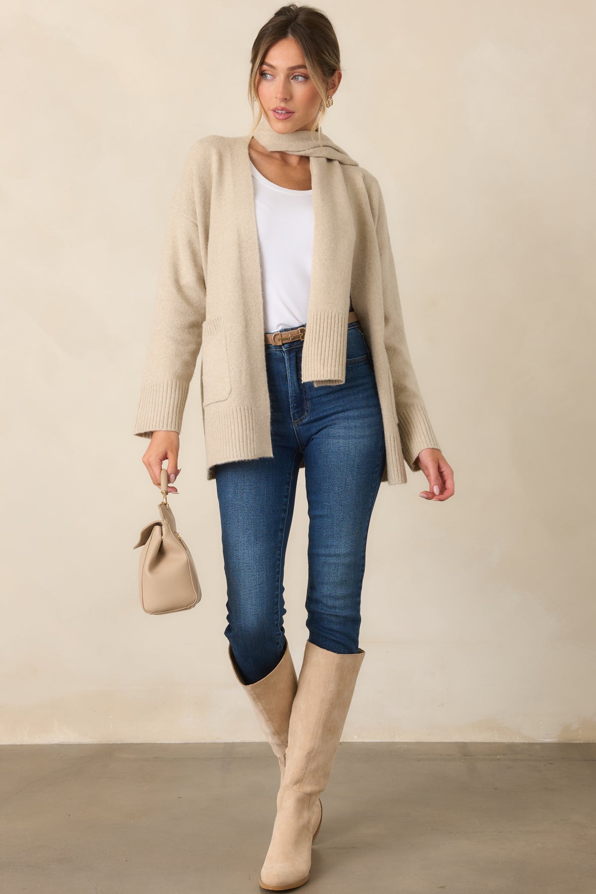 Relaxed open-front cardigan with dropped shoulders, long sleeves, front patch pockets, and a matching scarf.