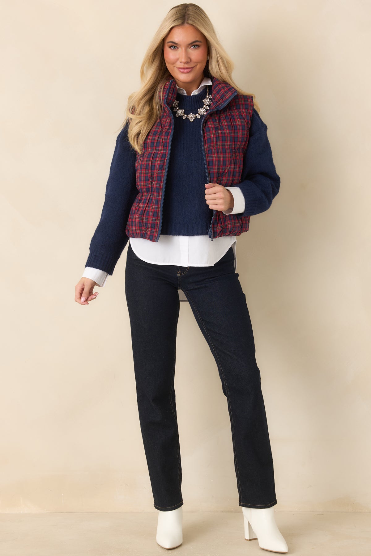 Relaxed plaid vest with rounded quilted panels and practical side pockets.