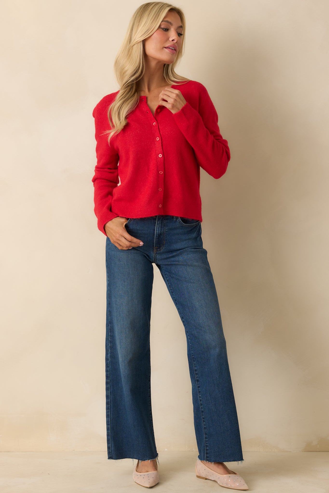 Relaxed-fit red cardigan with soft fabric, ribbed cuffs and hem, and classic crew neckline.