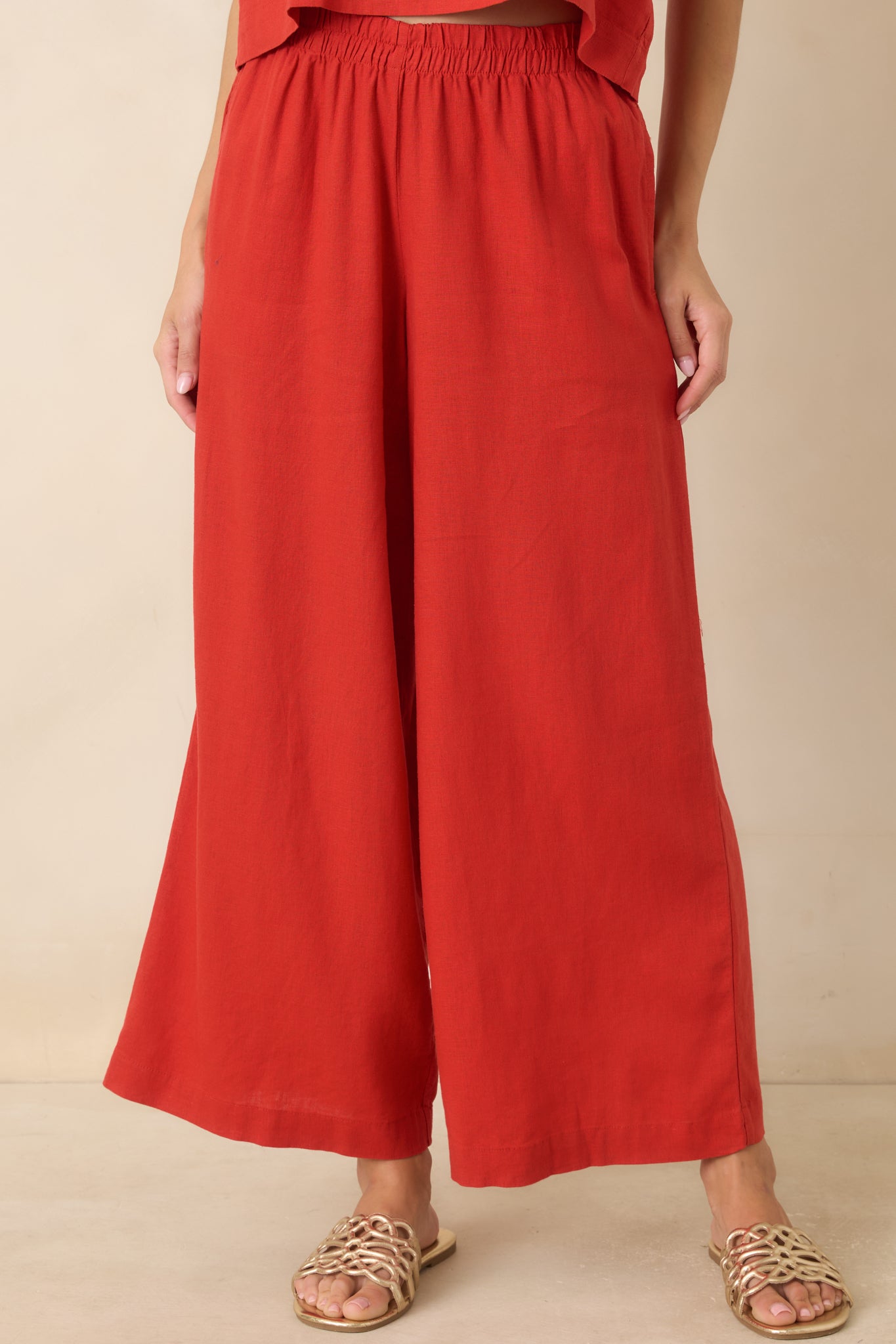 Relaxed red pants showcasing the comfortable drape and effortless polished design.
