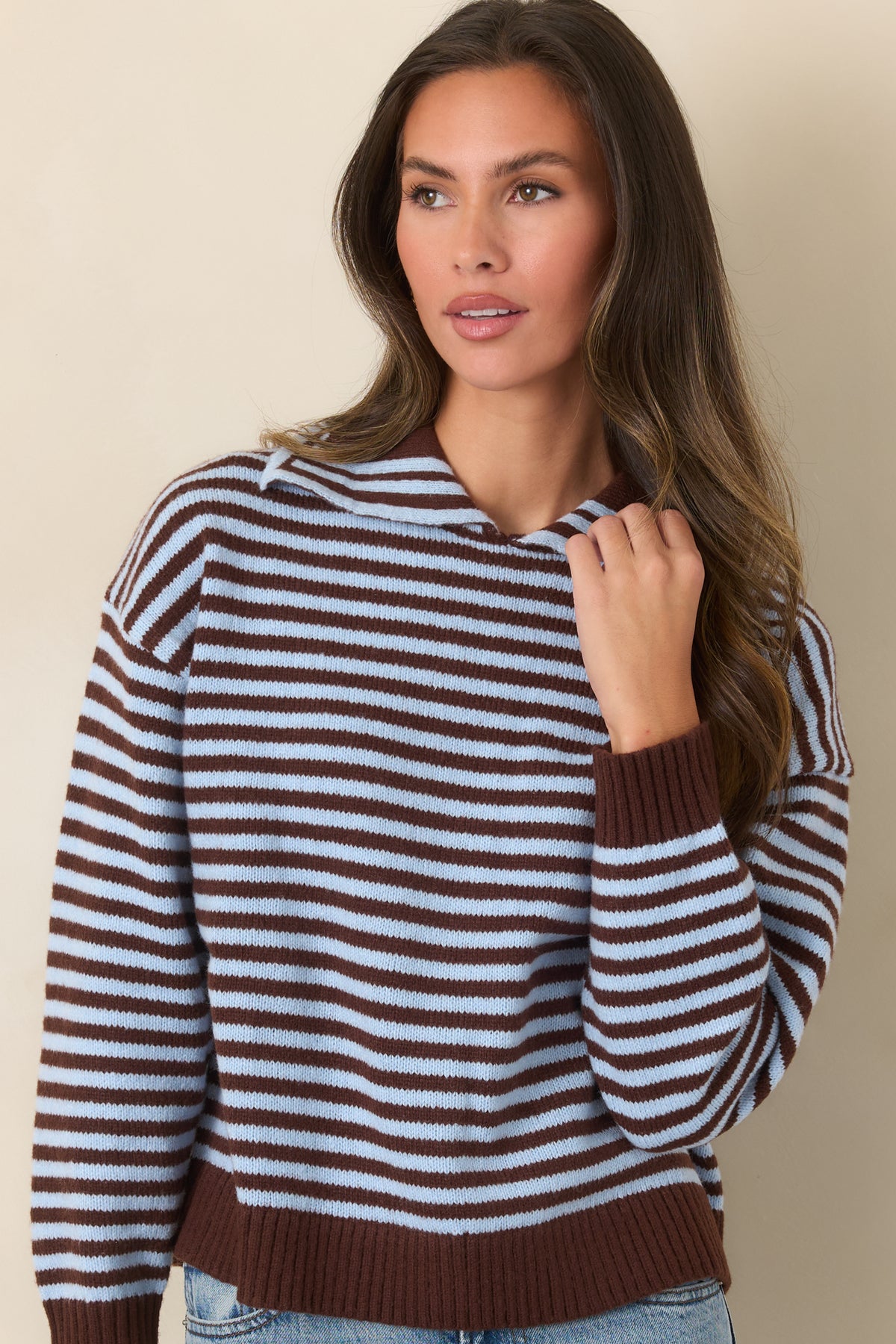 Relaxed striped knit featuring dropped shoulders and a solid brown ribbed collar.
