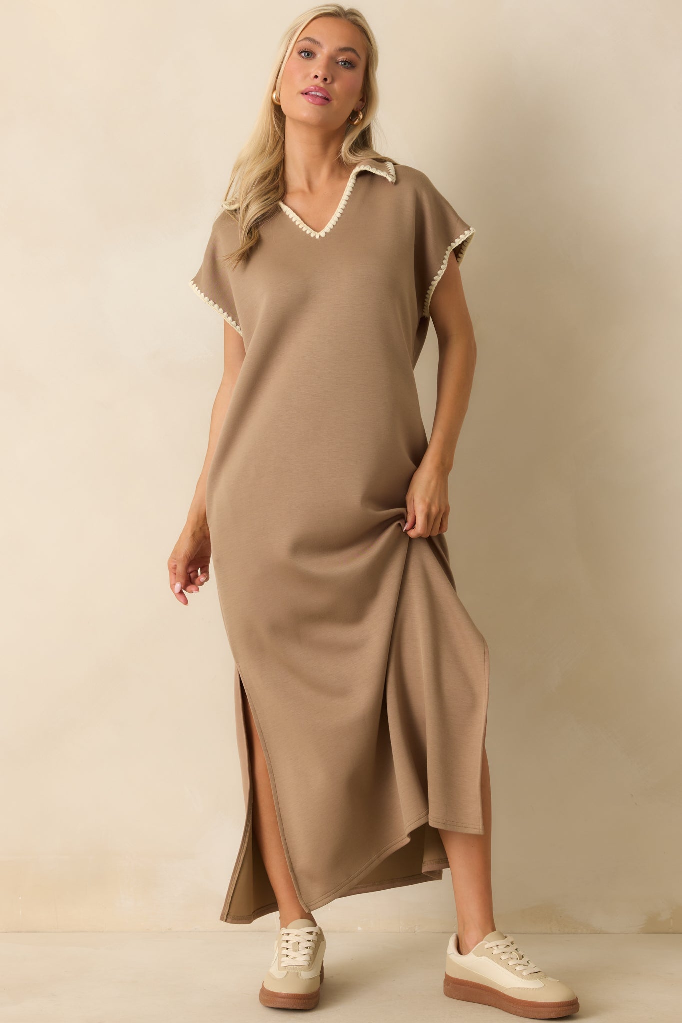 Relaxed silhouette maxi dress in buttery-soft tan knit with ivory whipstitch trim.