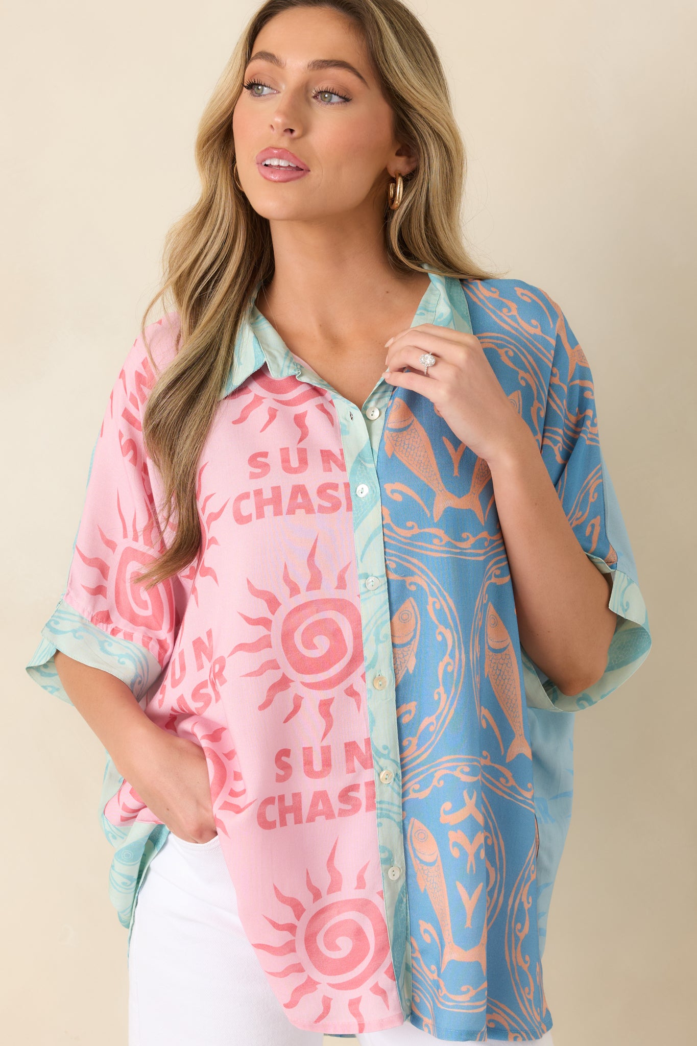 Relaxed viscose top highlighting the playful colorblock design and fluid button-up silhouette.