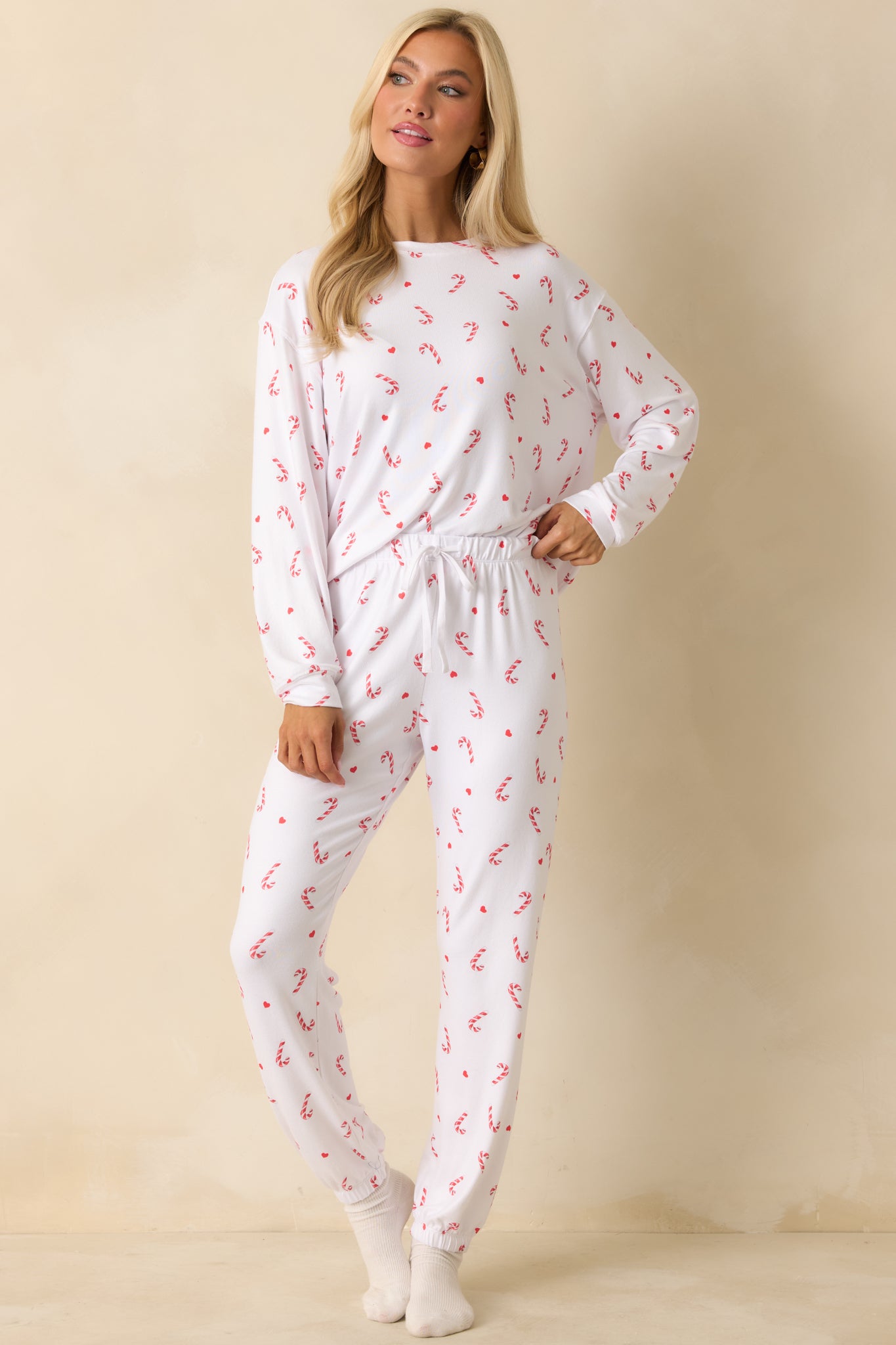 Relaxed-fit white jersey top covered in playful candy-cane motifs and designed for easy, comfortable wear.