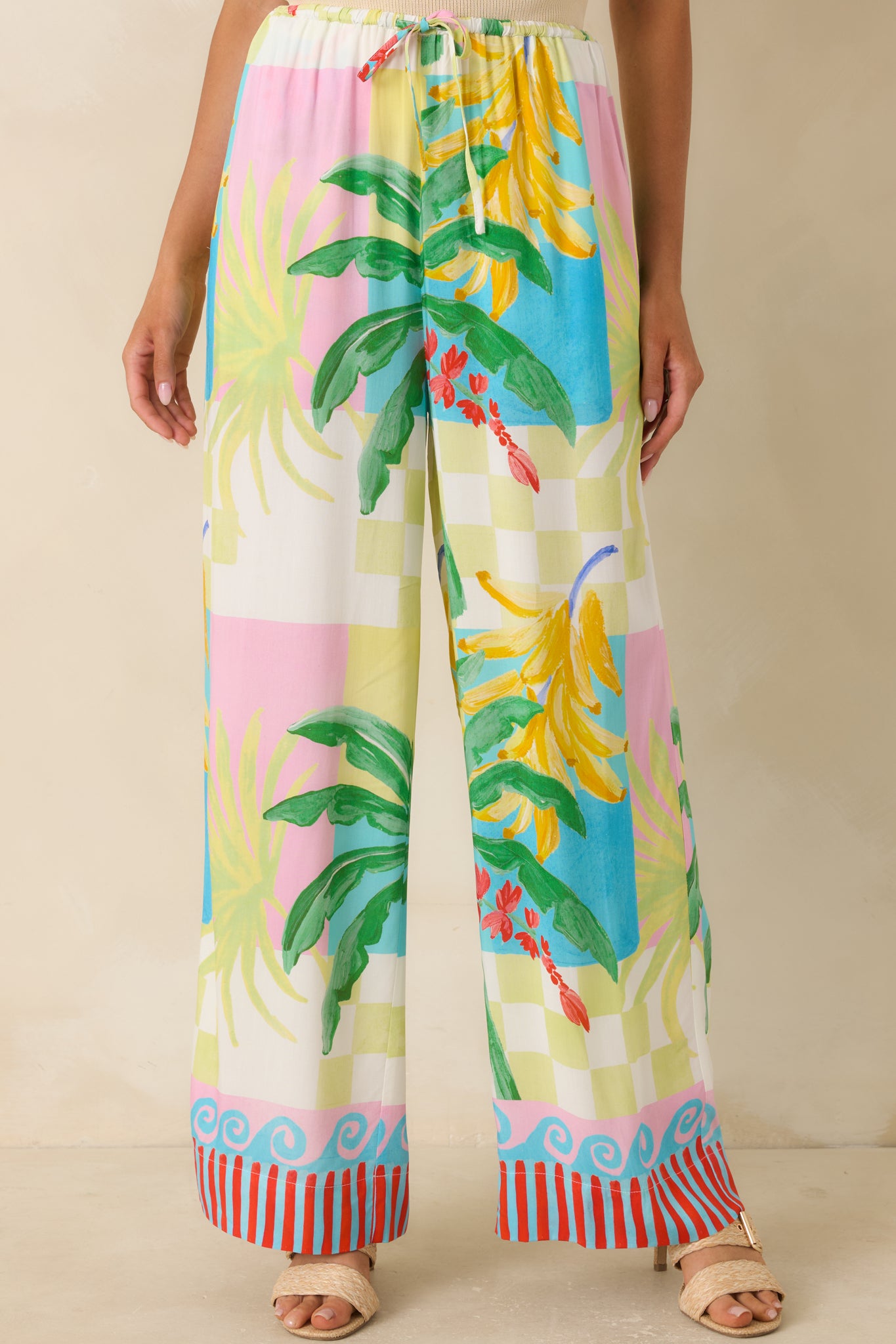 Detailed look at the relaxed wide-leg silhouette, side pocket detail, and vibrant vacation-inspired pattern.