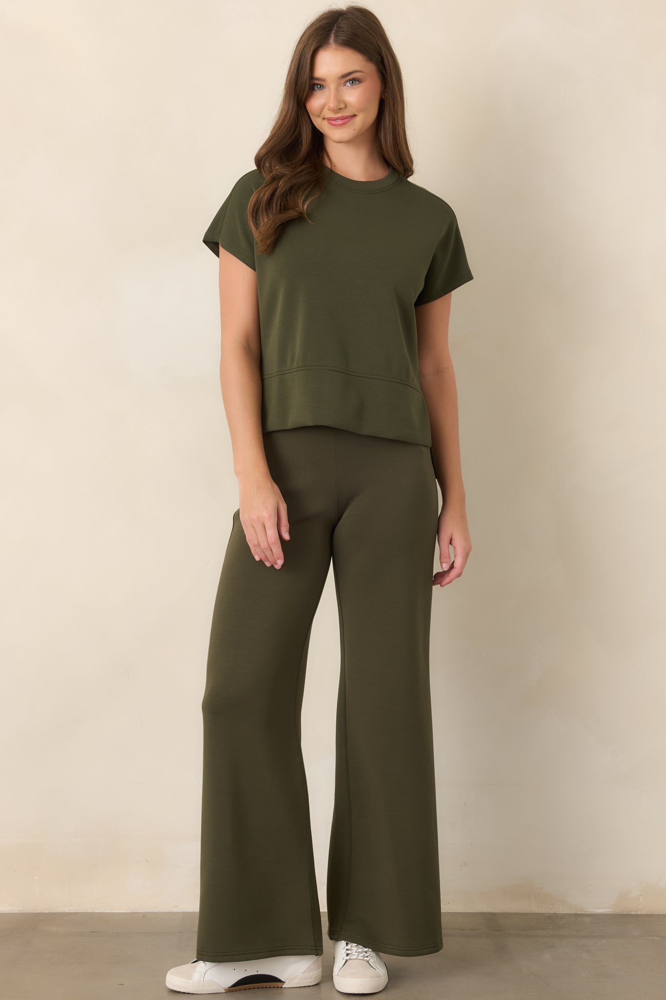 Relaxed wide-leg pants featuring a pull-on waistband, adjustable drawstring, fluid drape, and comfortable four-way stretch construction.