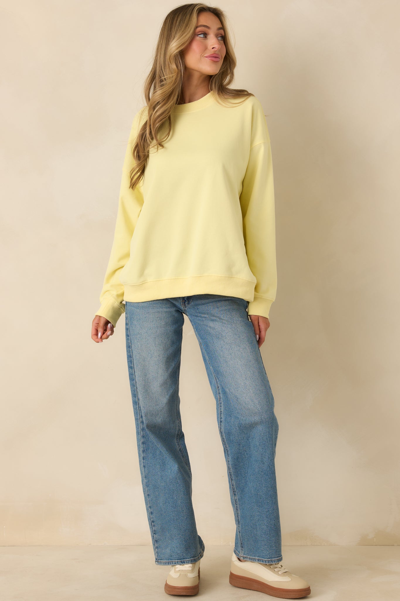 Relaxed-fit yellow crewneck with ribbed hem trim for everyday comfort.