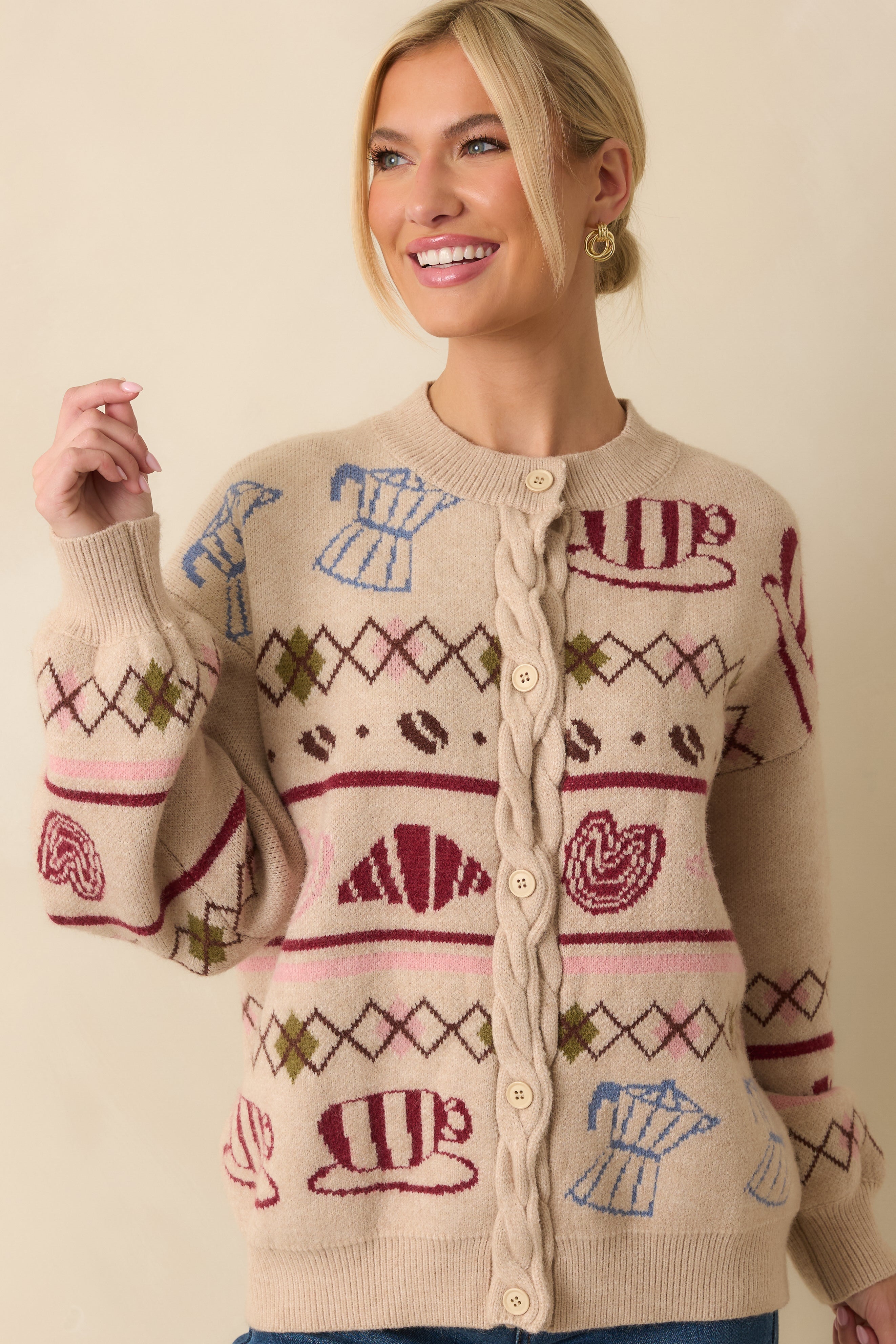 Detail showing the ribbed cuff and smooth knit pattern along the sleeve.