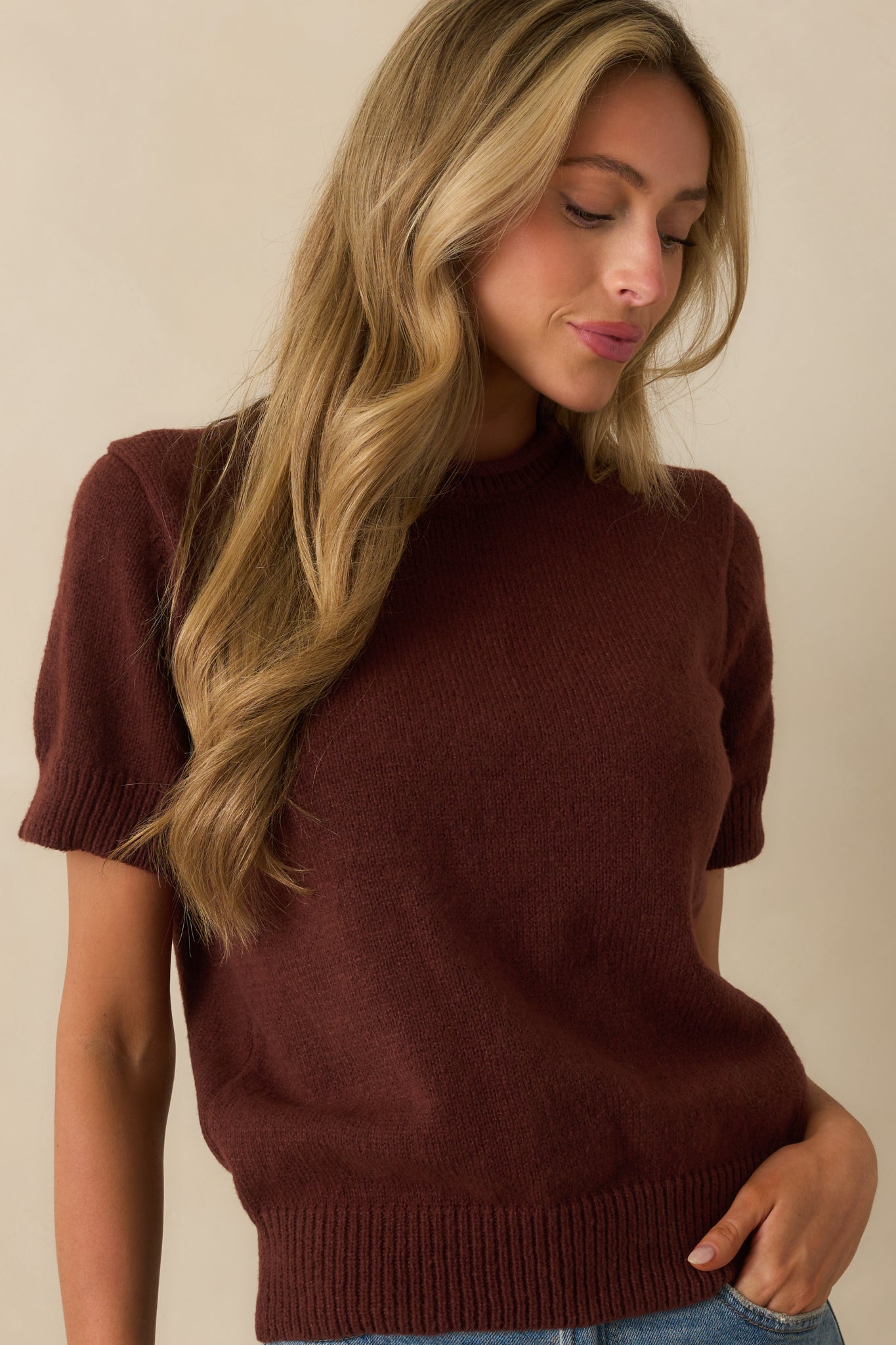 Cropped view highlighting ribbed hems and short sleeve design.